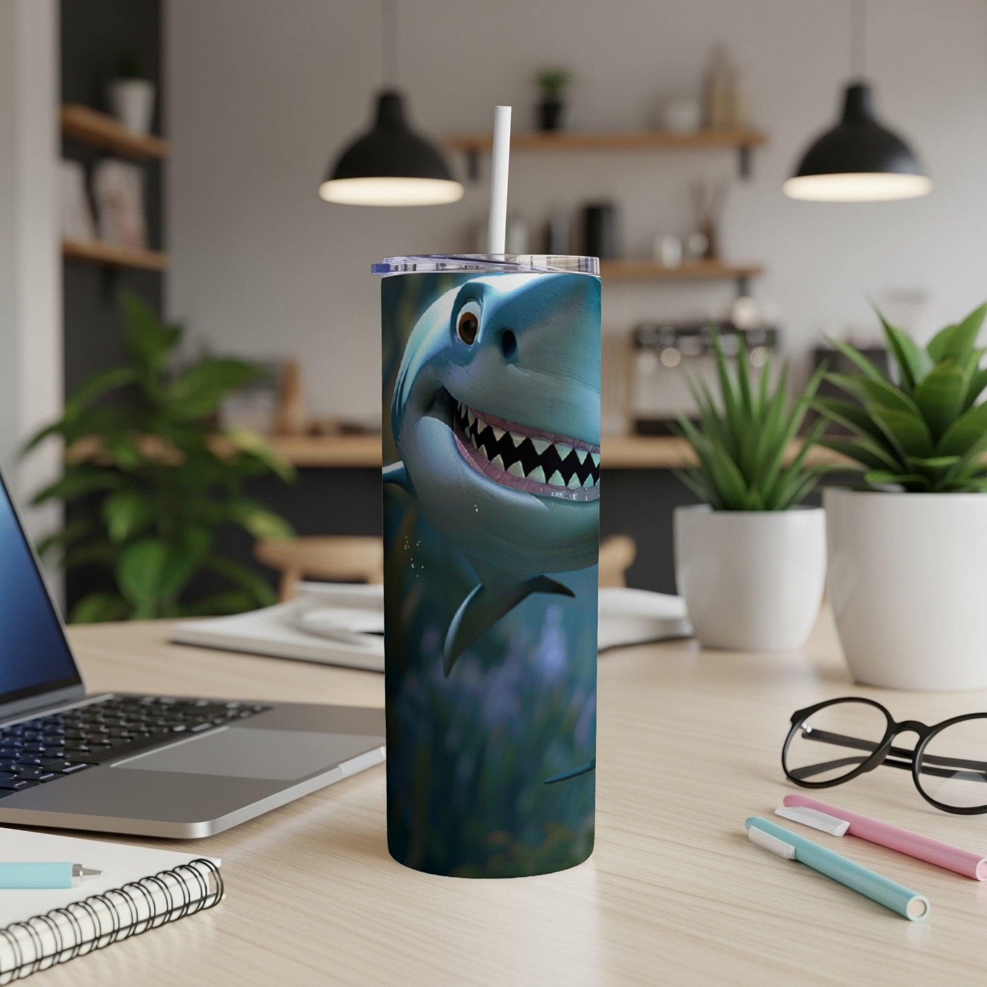 Cartoon shark with wide smile and sharp teeth on a travel tumbler.