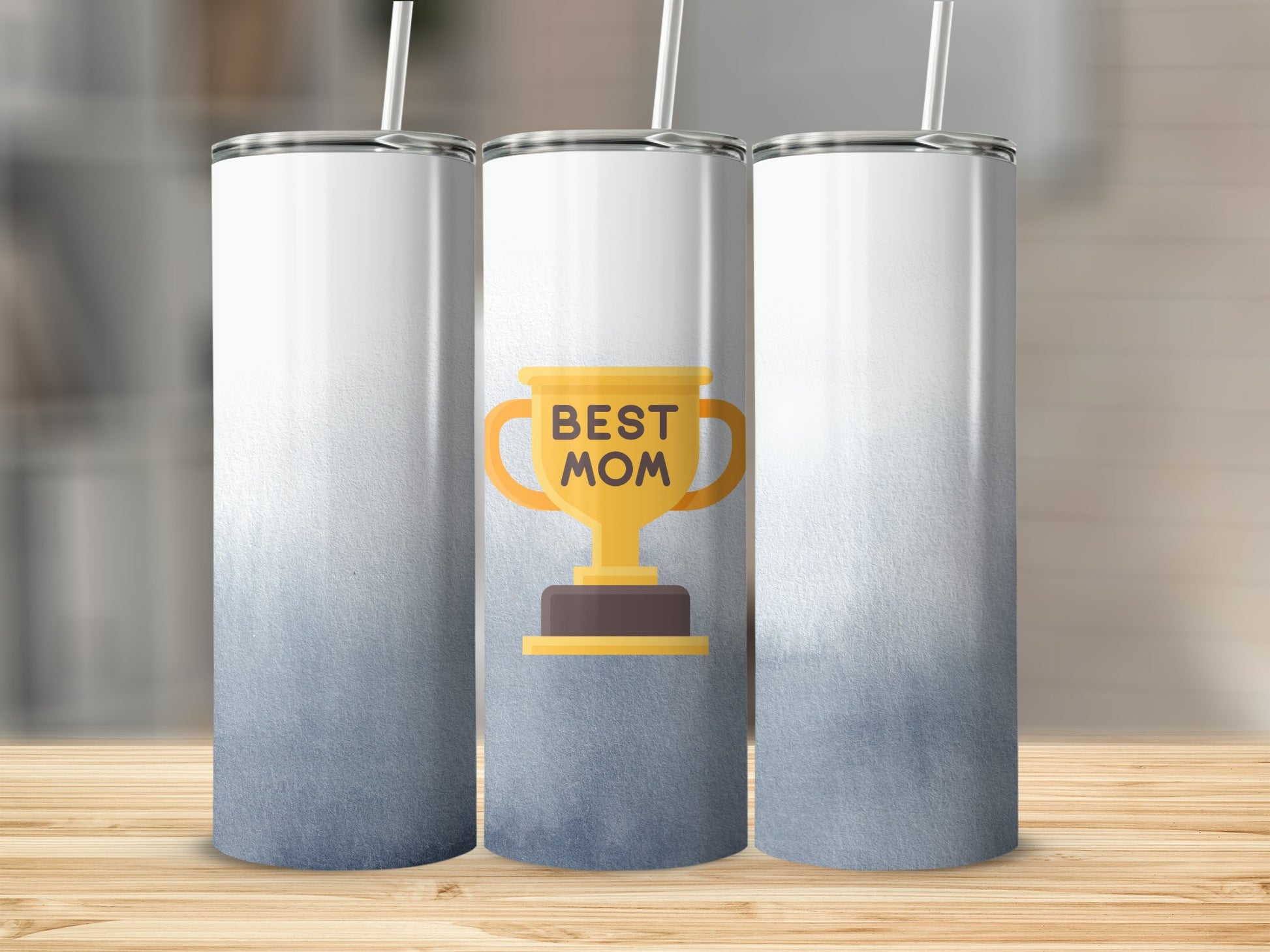 Trophy cup with "BEST MOM" text on a gradient tumbler with straw.