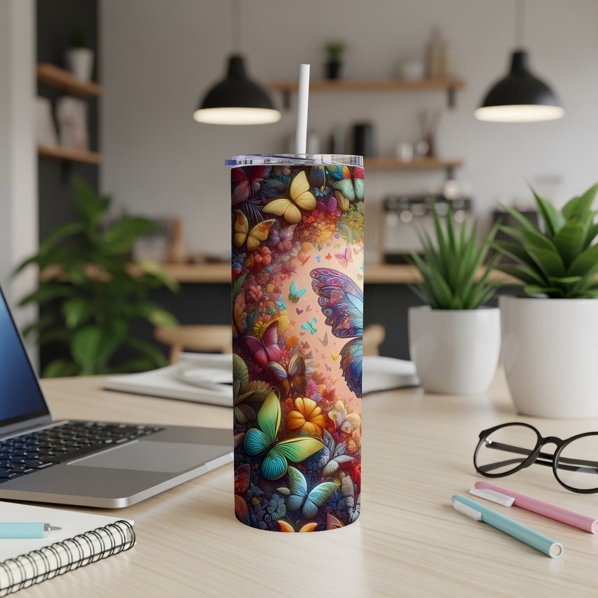 Tall tumbler adorned with colorful butterflies and floral designs.