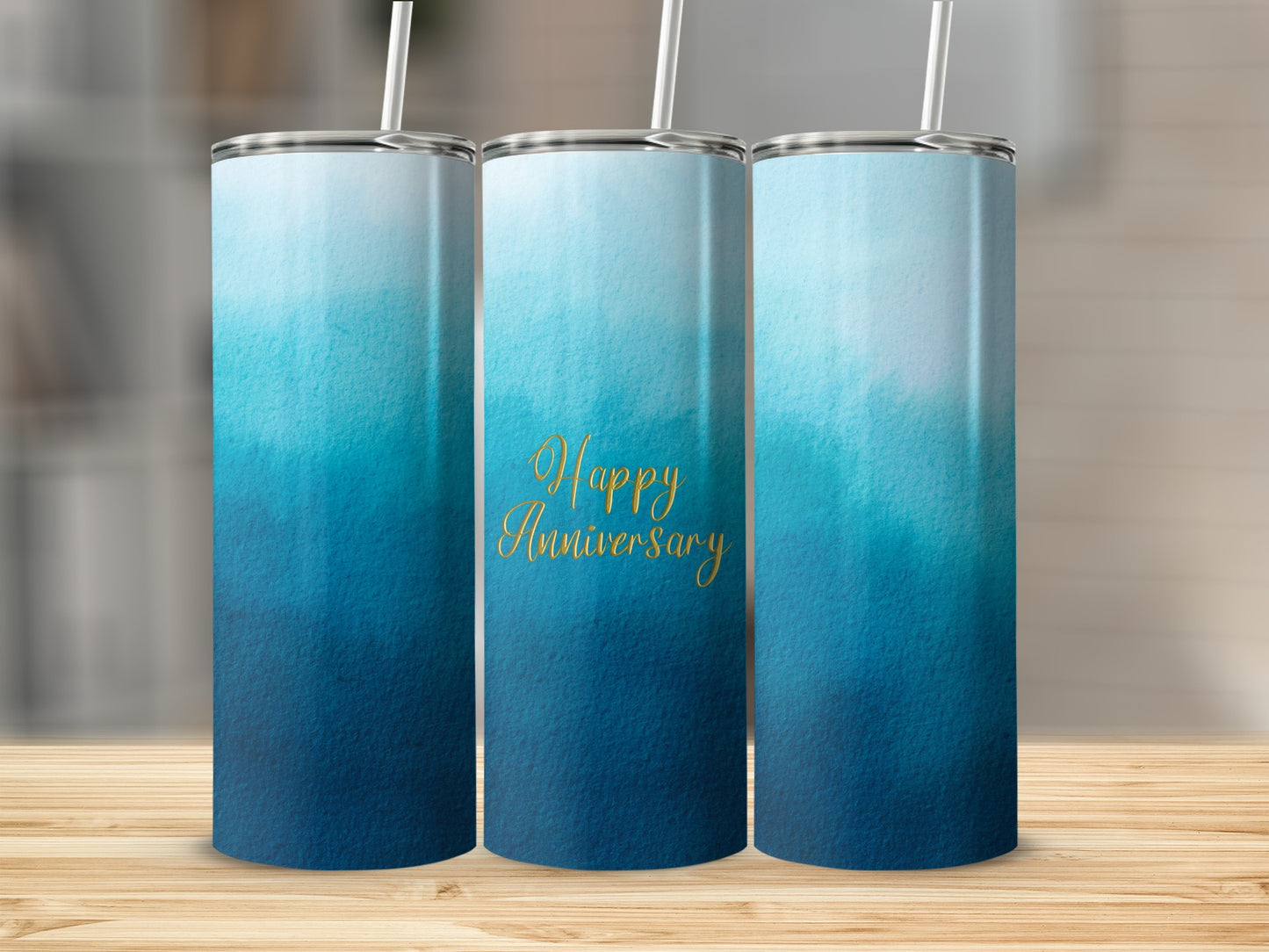 Three blue ombre tumblers with "Happy Anniversary" text.