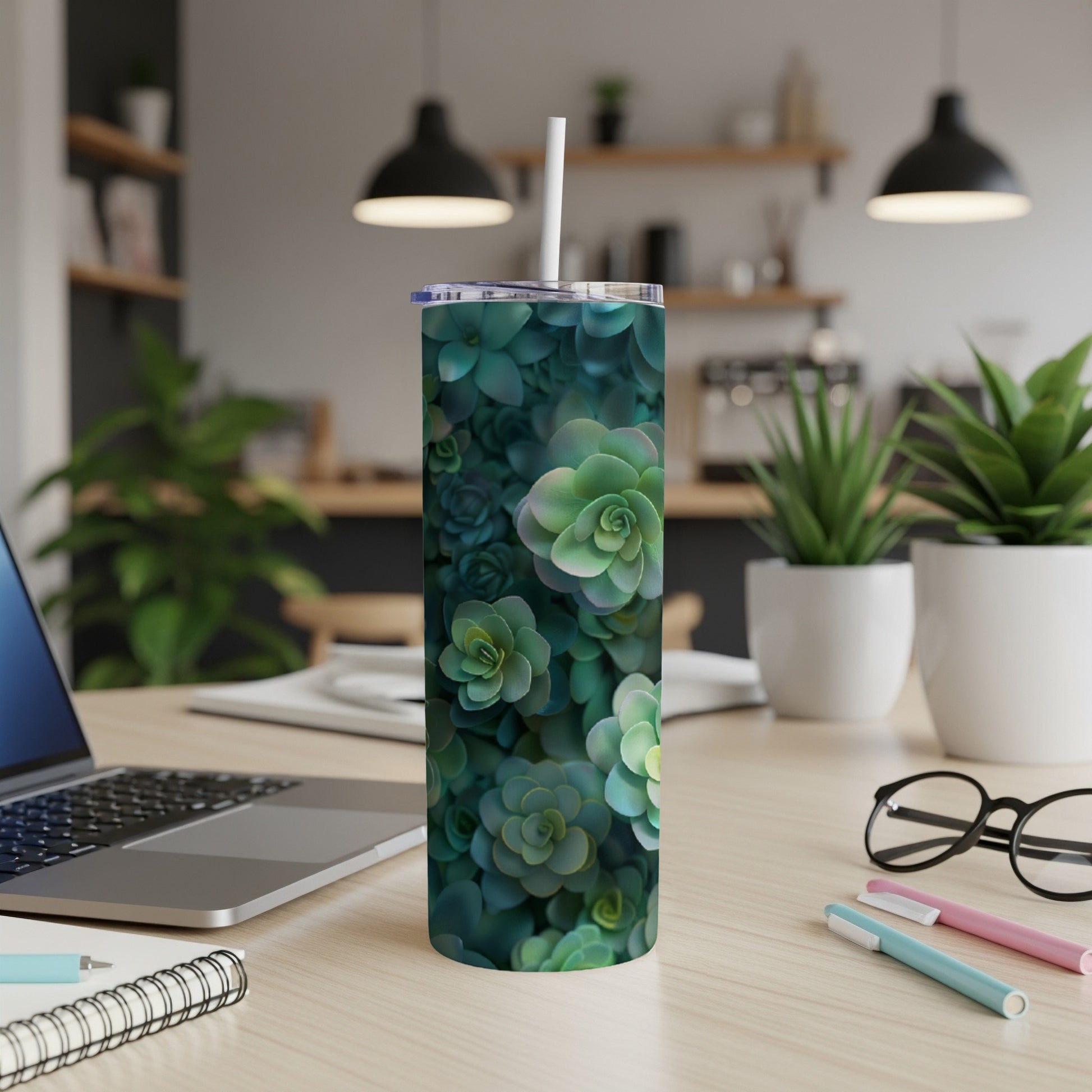 Green succulent plant pattern on a white skinny tumbler with a straw.