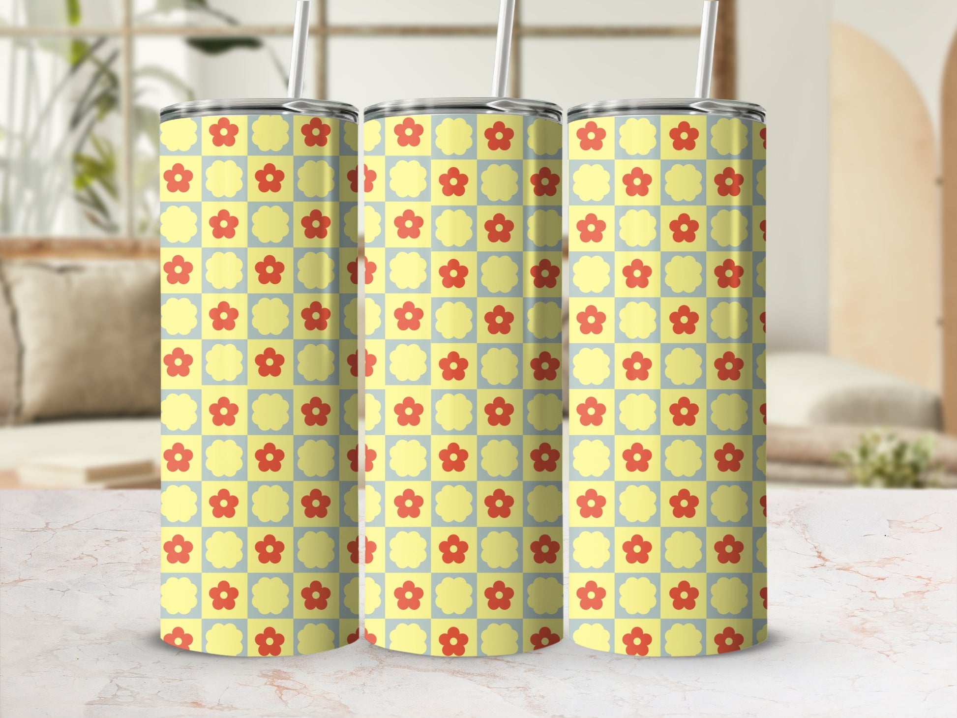 Three tumblers with a yellow and red floral grid pattern.