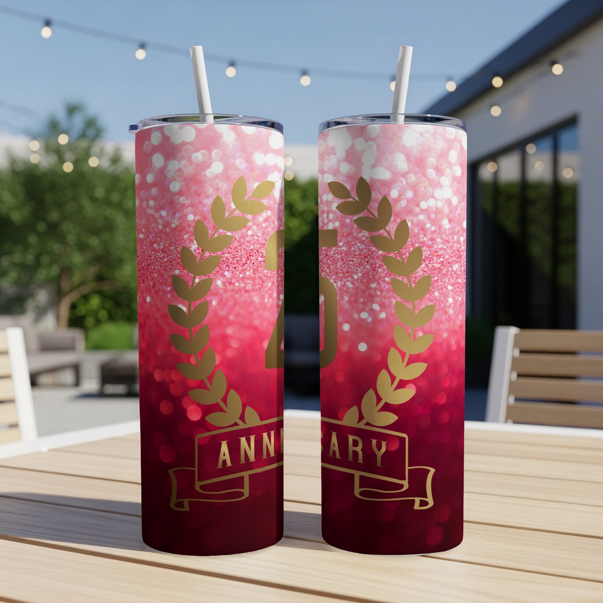 Two tumblers with "50th Anniversary" text on a glittery pink background.