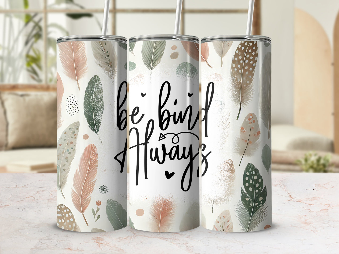 "Be Kind Always" text on a tumbler with feather and floral pattern.