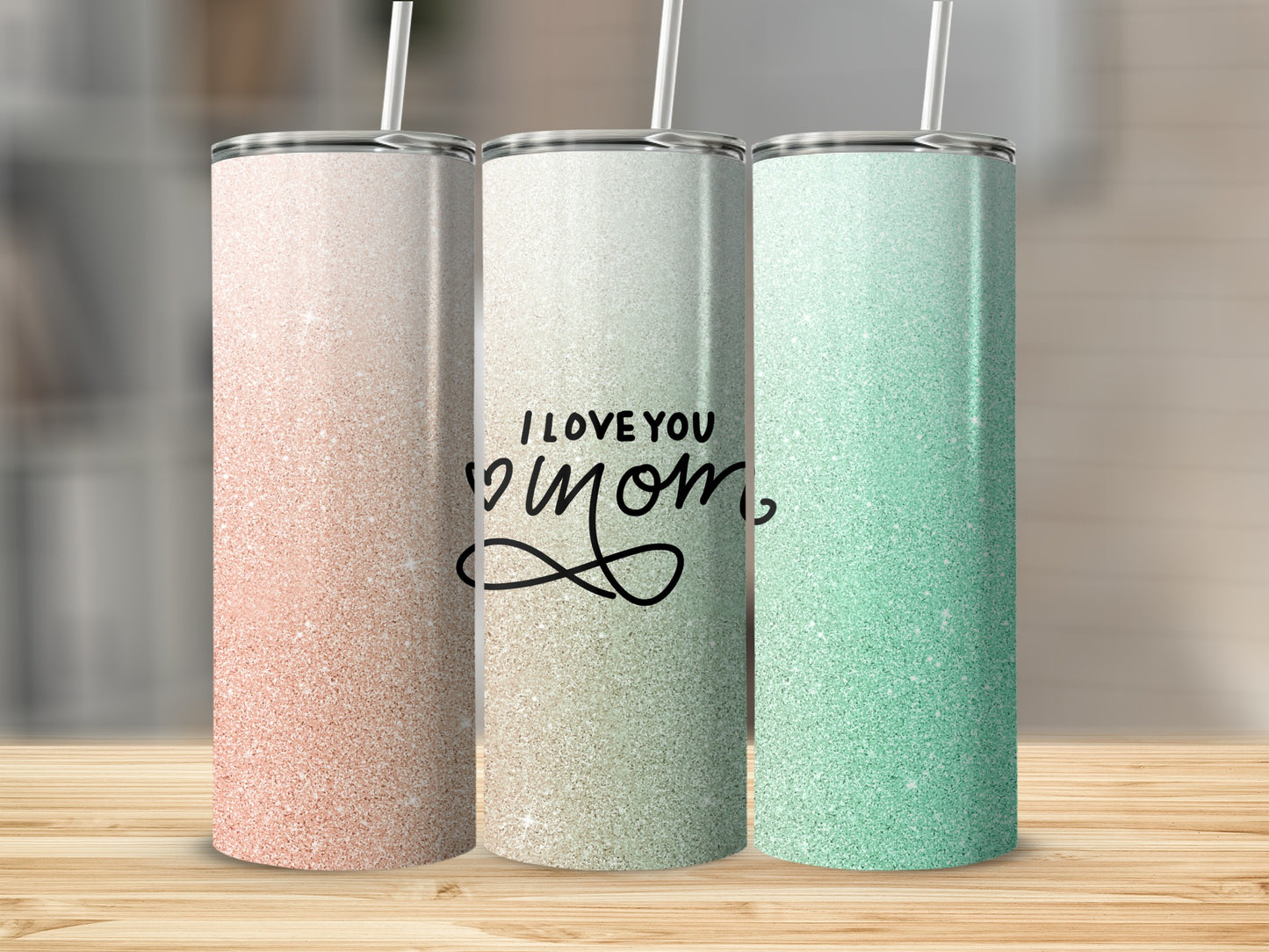 Three glitter tumblers, two with straws, one with text "I LOVE YOU MOM".