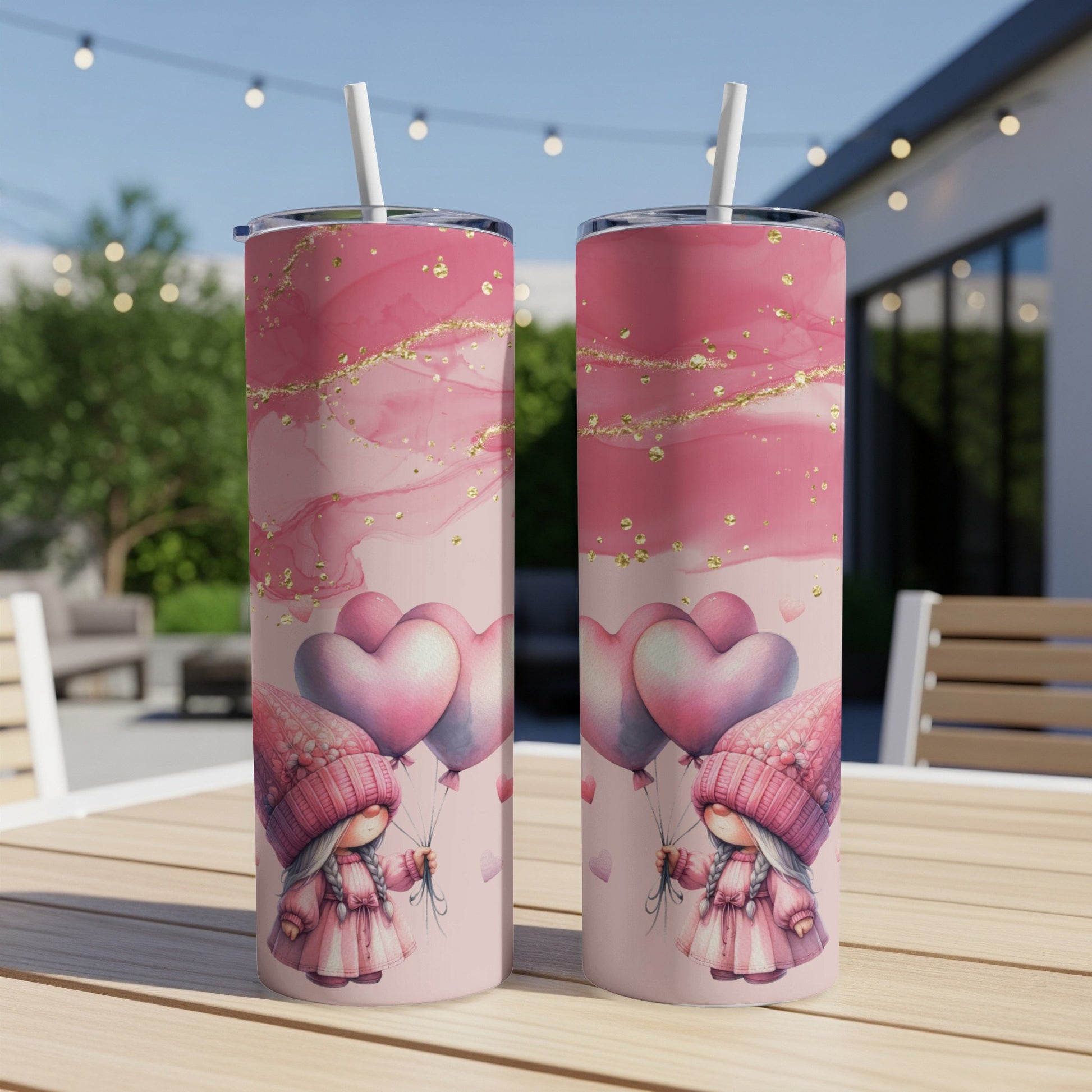 Two pink gnomes with heart balloons and abstract pink and gold design on tumblers.