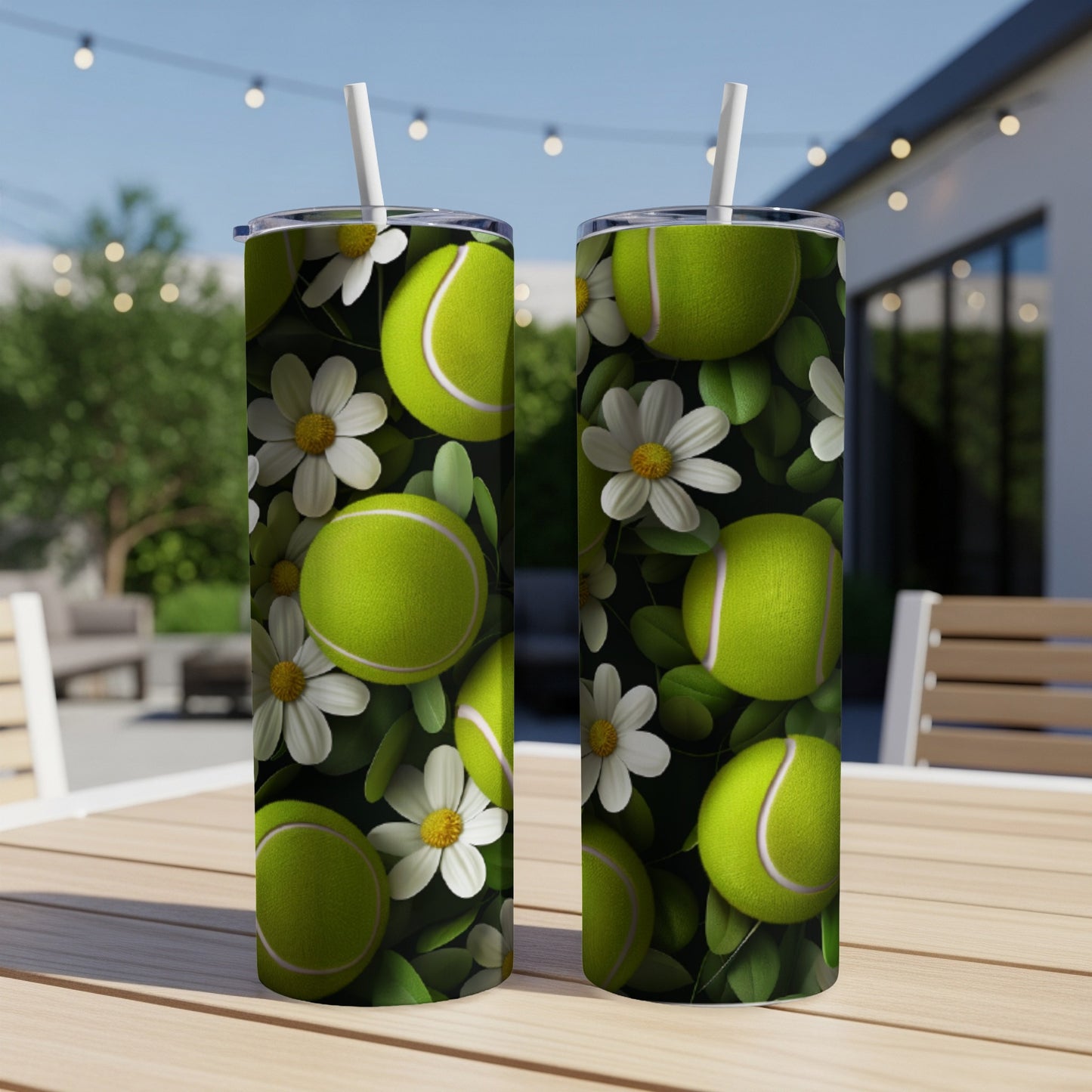 Two tall tumblers with a tennis ball and daisy pattern.