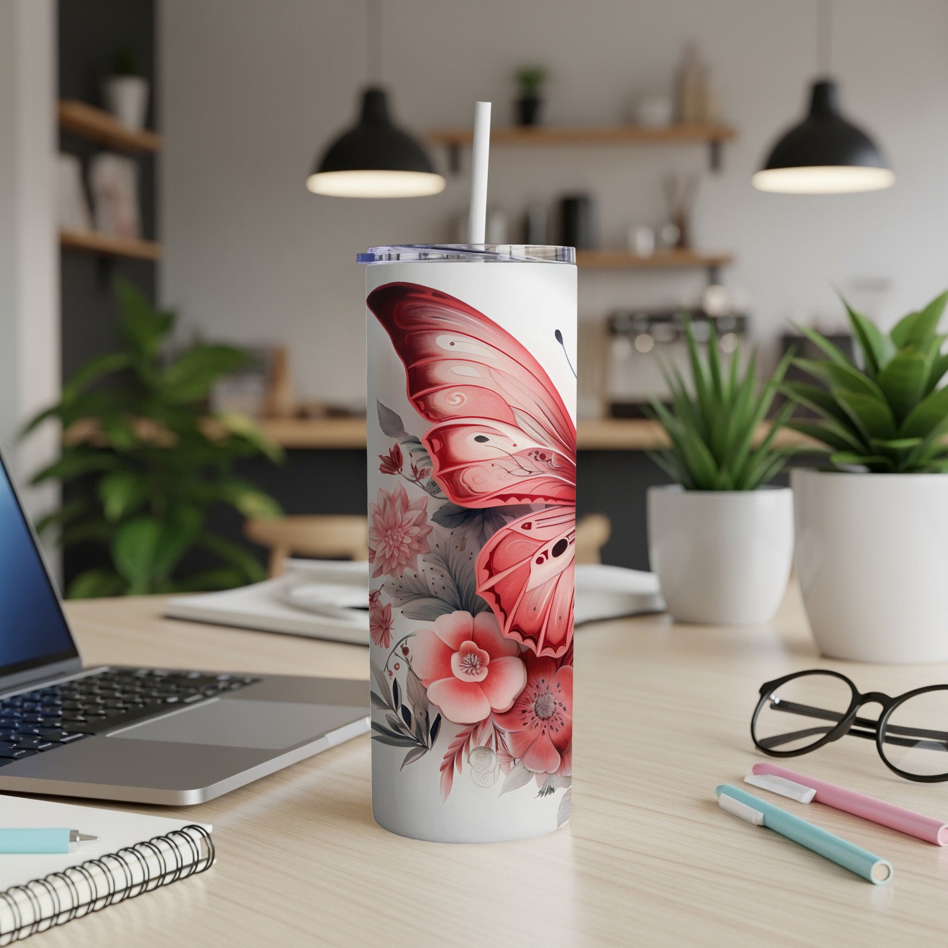 White tumbler with pink butterfly and floral design.