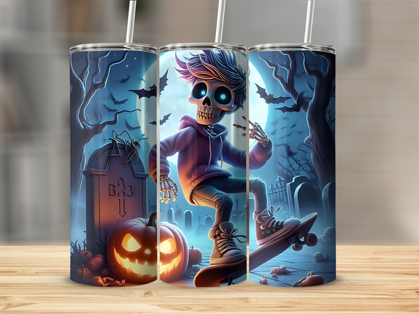 Three tumblers featuring a spooky Halloween graveyard scene with a skateboarding skeleton.