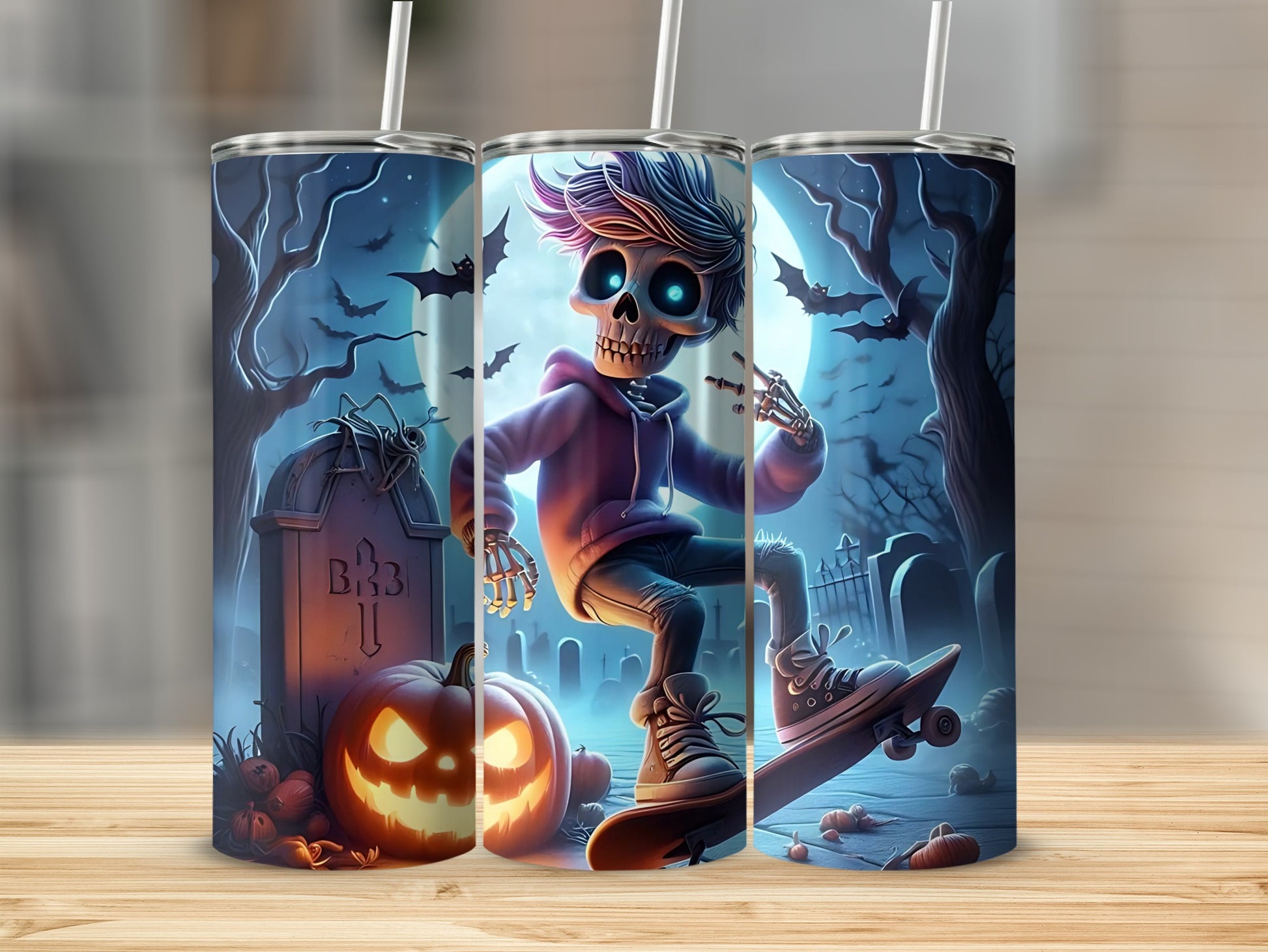 Three tumblers featuring a spooky Halloween graveyard scene with a skateboarding skeleton.