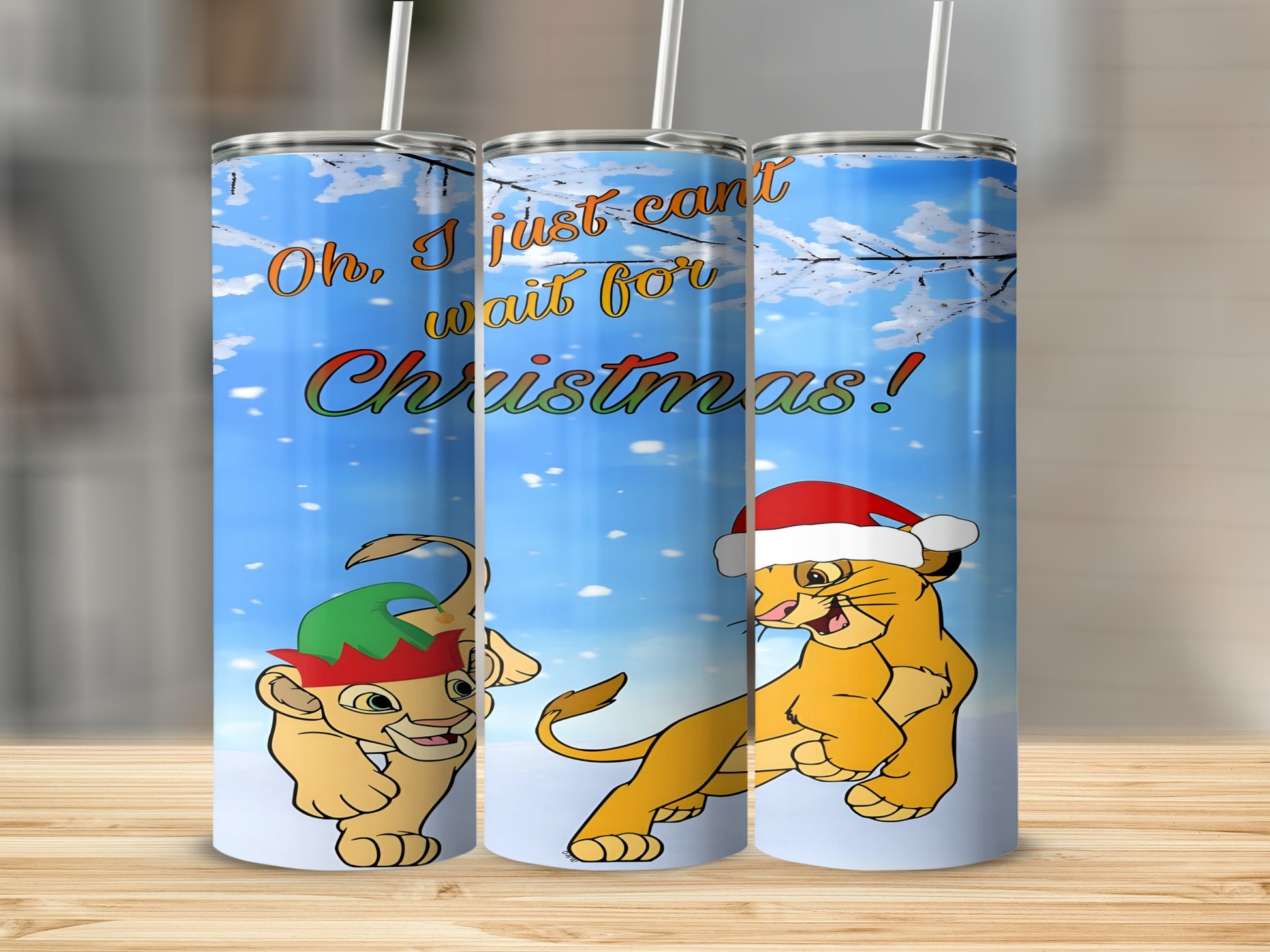 Simba and Nala with Christmas hats and elf hat in snow.