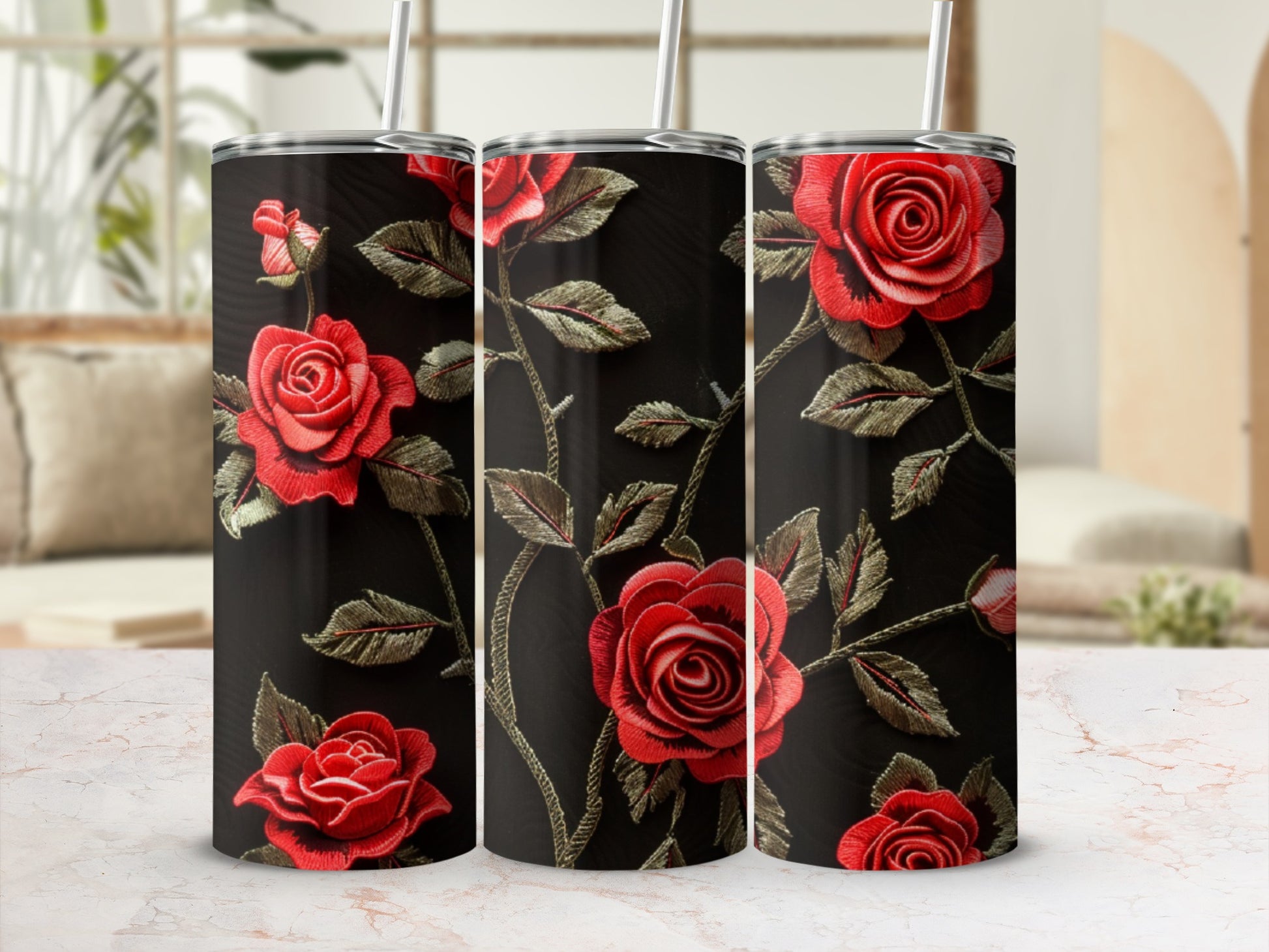 Three tumblers with a red rose and vine pattern on a black background.