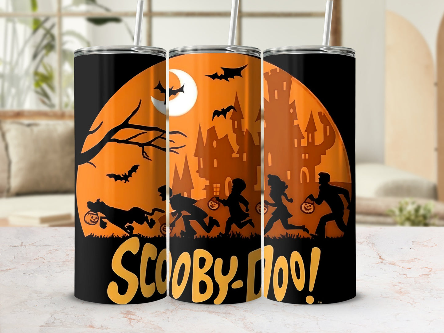 Scooby-Doo Halloween tumblers with characters trick-or-treating before a spooky castle.