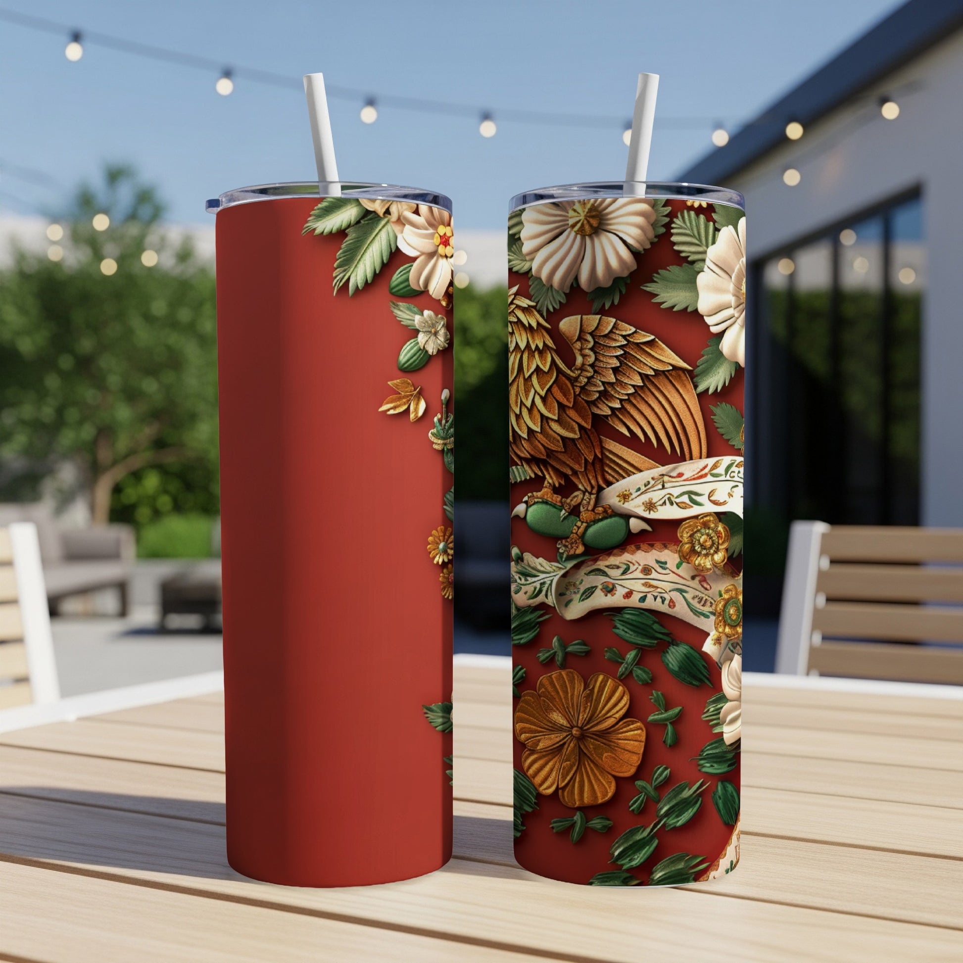 Red tumbler with a detailed eagle and floral design.