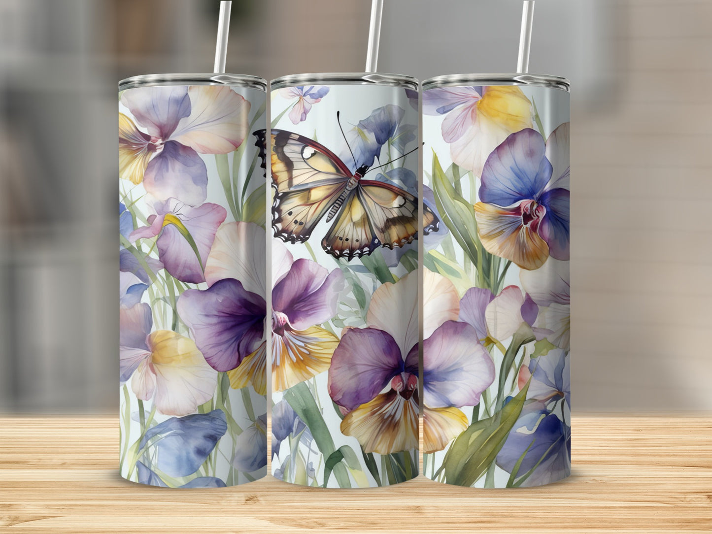 Three tumblers with a watercolor butterfly and floral design.