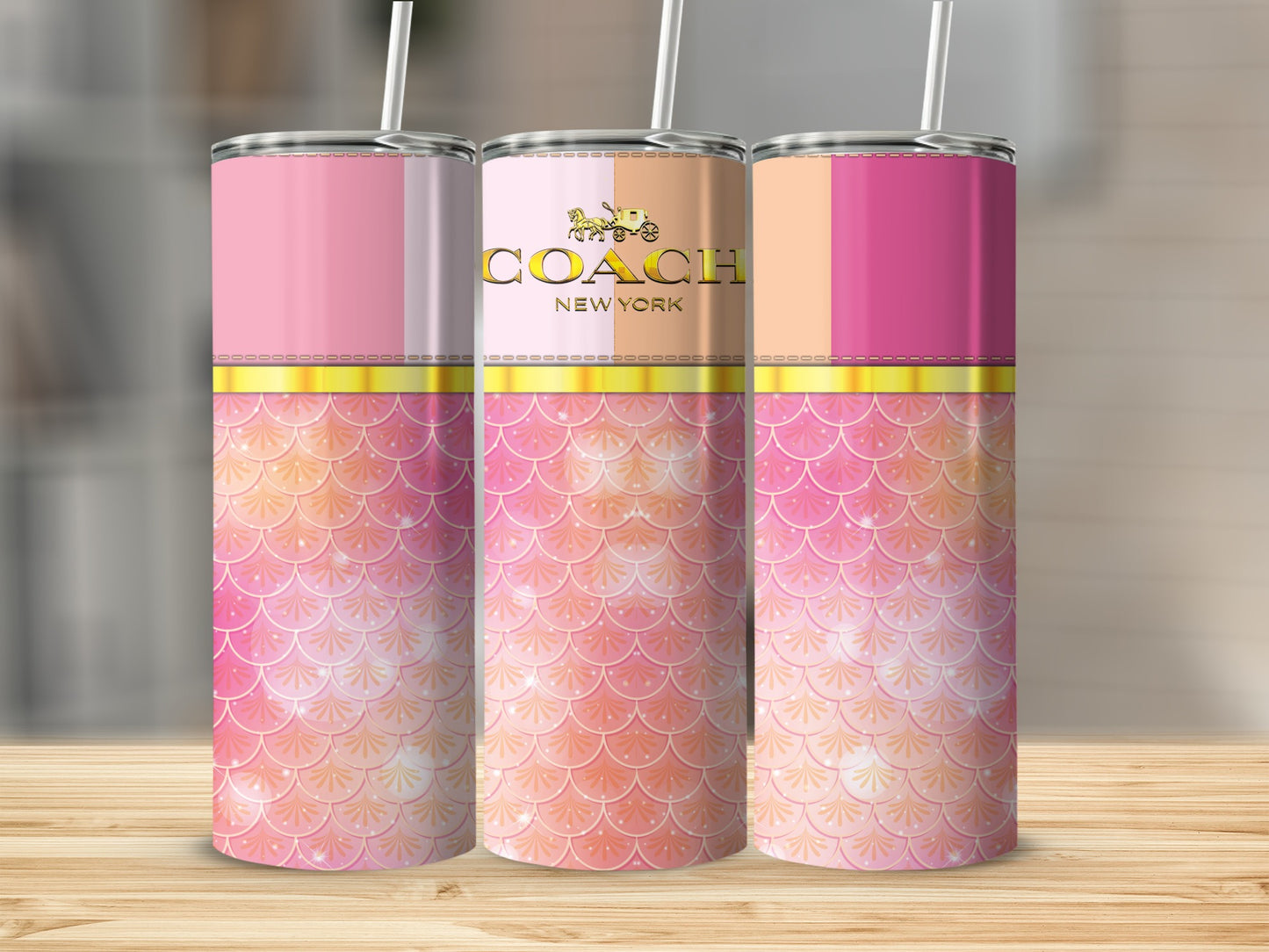 Three skinny tumblers with Coach logo and pink mermaid scale design.