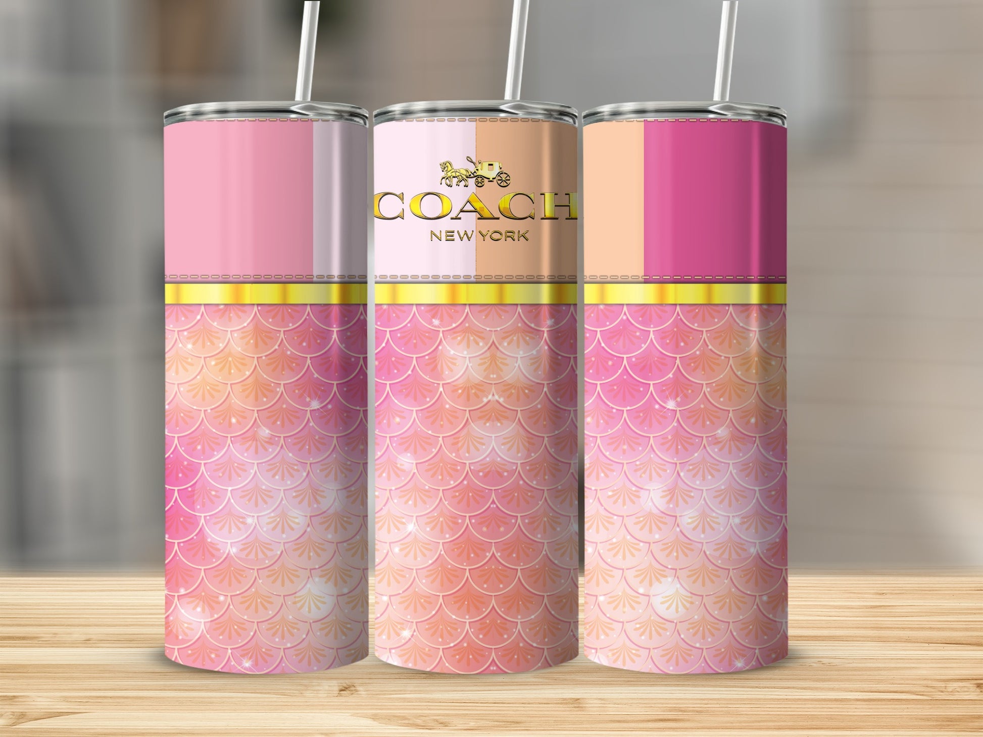 Three skinny tumblers with Coach logo and pink mermaid scale design.