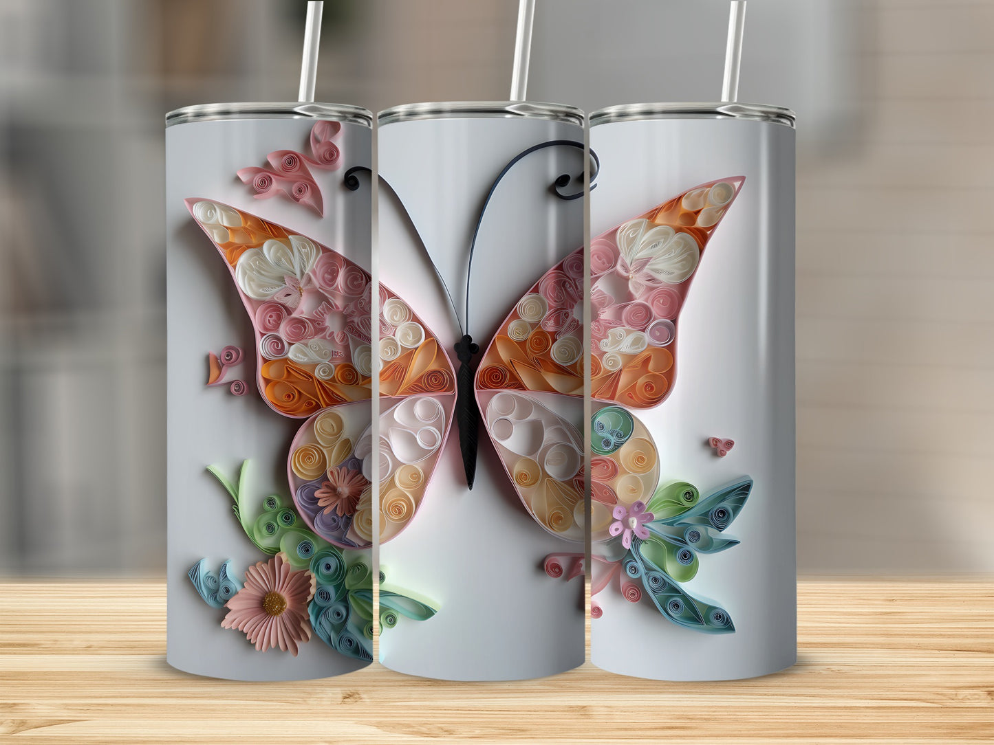 Three tumblers with a pastel butterfly design made from quilled paper.