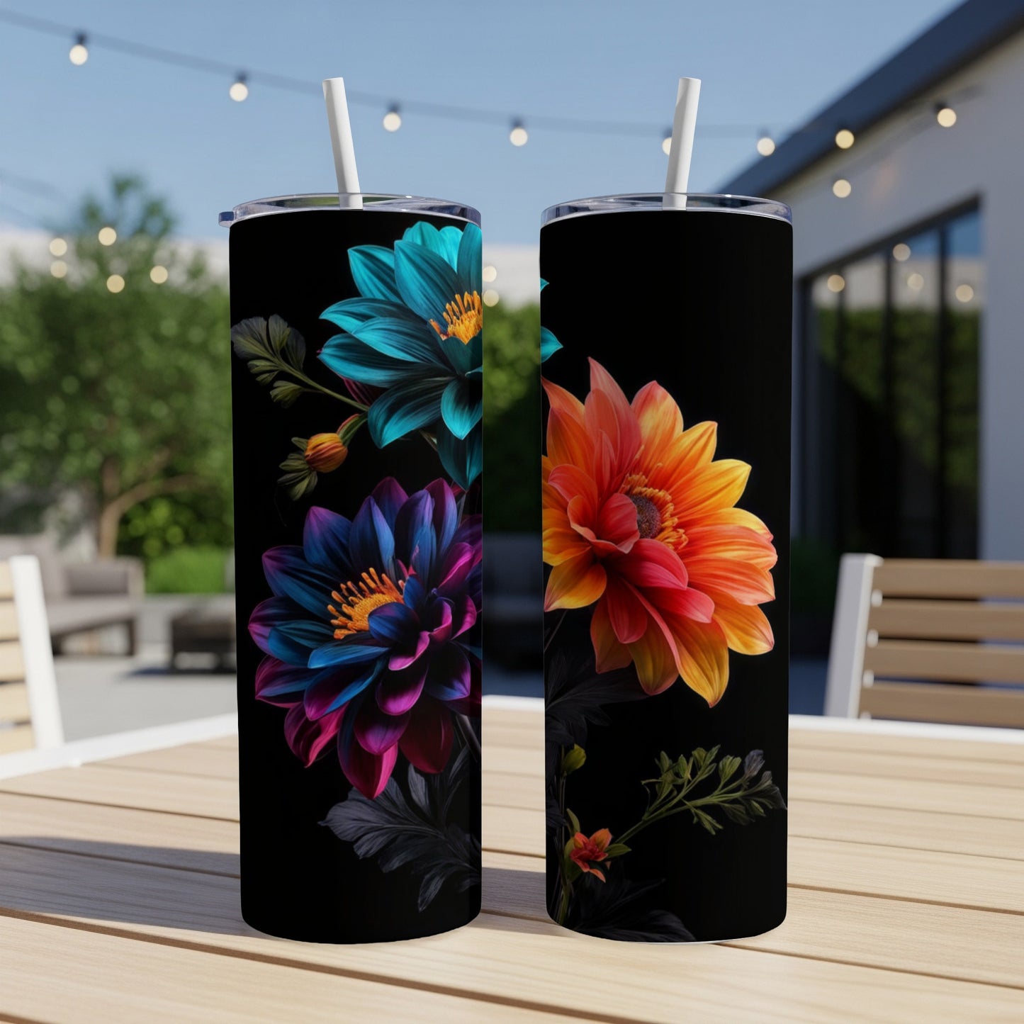 Two tumblers with vibrant floral designs on a dark background.