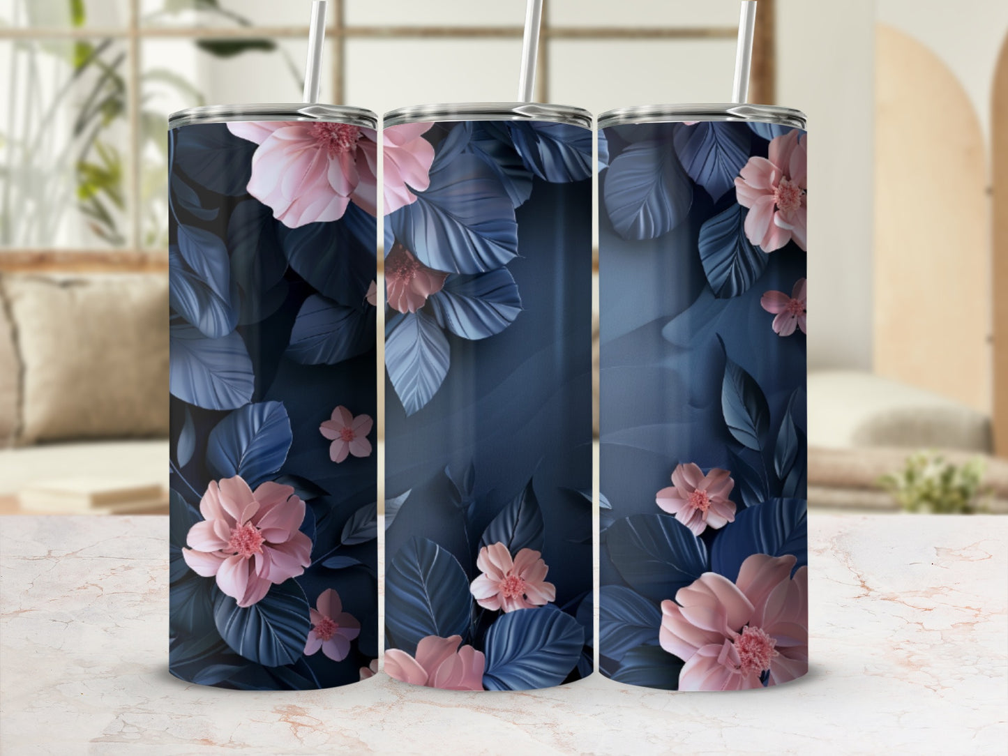 Three tumblers with pink flowers and dark blue leaves on a marbled surface.