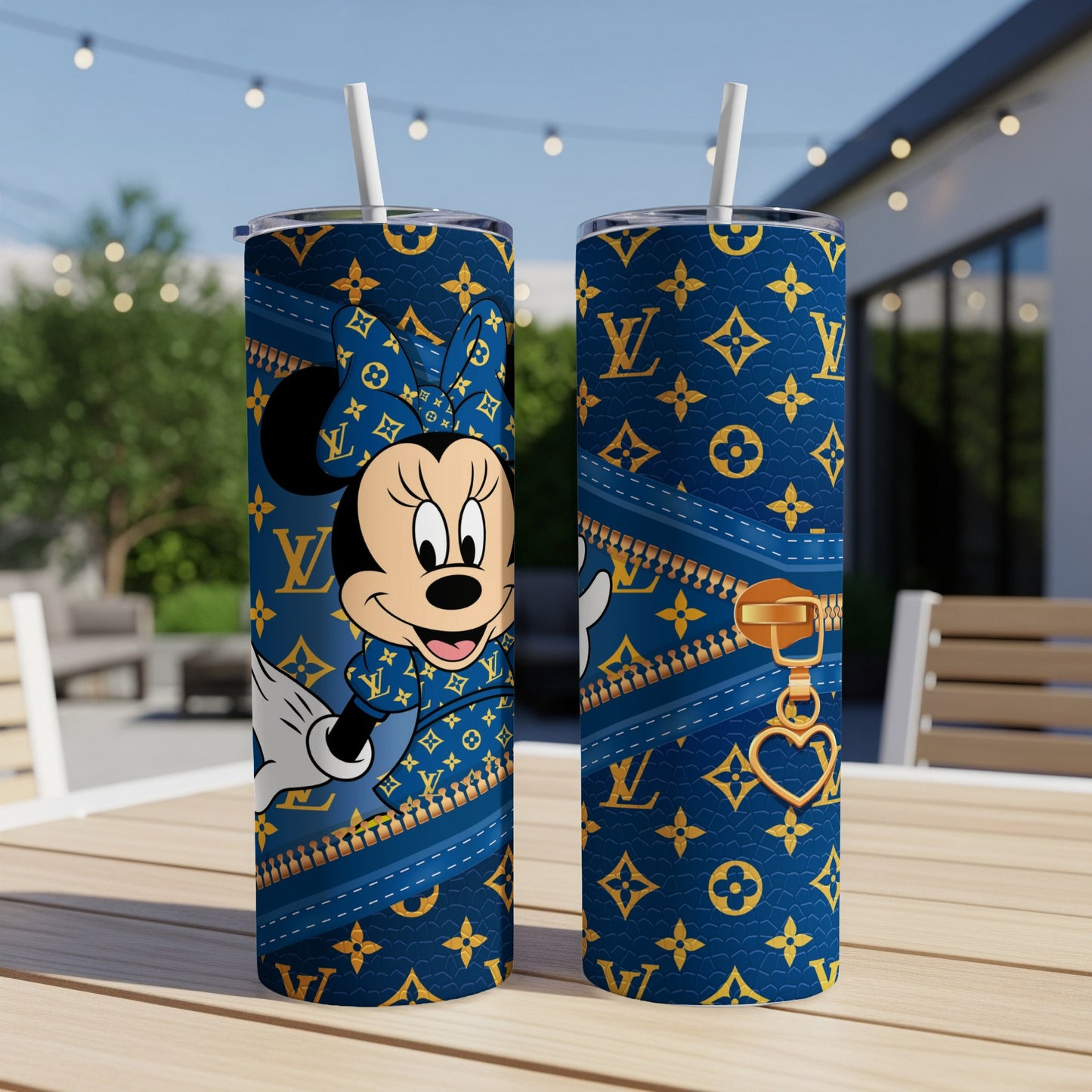 Minnie Mouse on a blue tumbler with Louis Vuitton pattern and gold zipper detail.