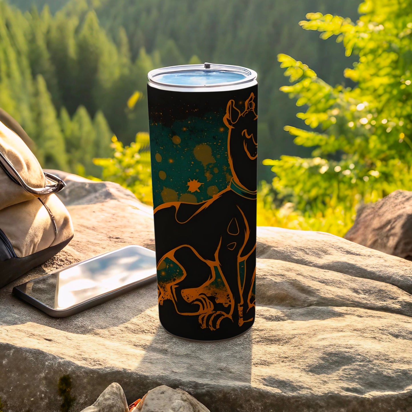 Black tumbler with Scooby-Doo graphic and orange speckles, outdoors.