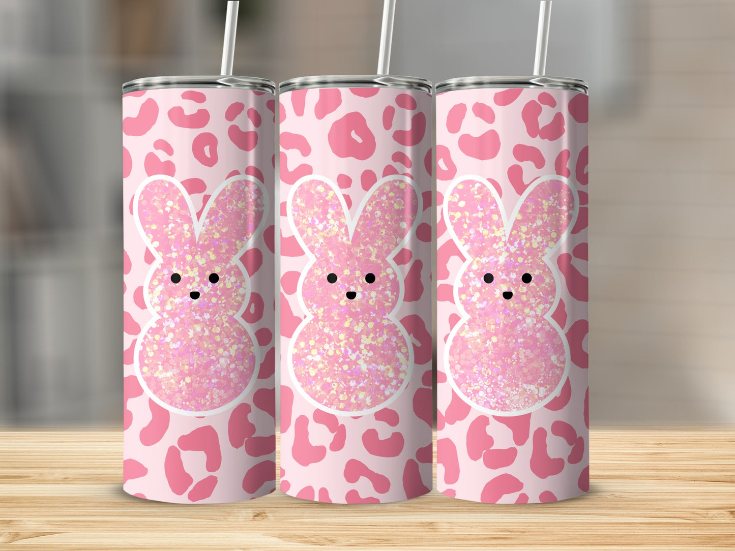Pink leopard print tumbler with glitter bunny design and straw.
