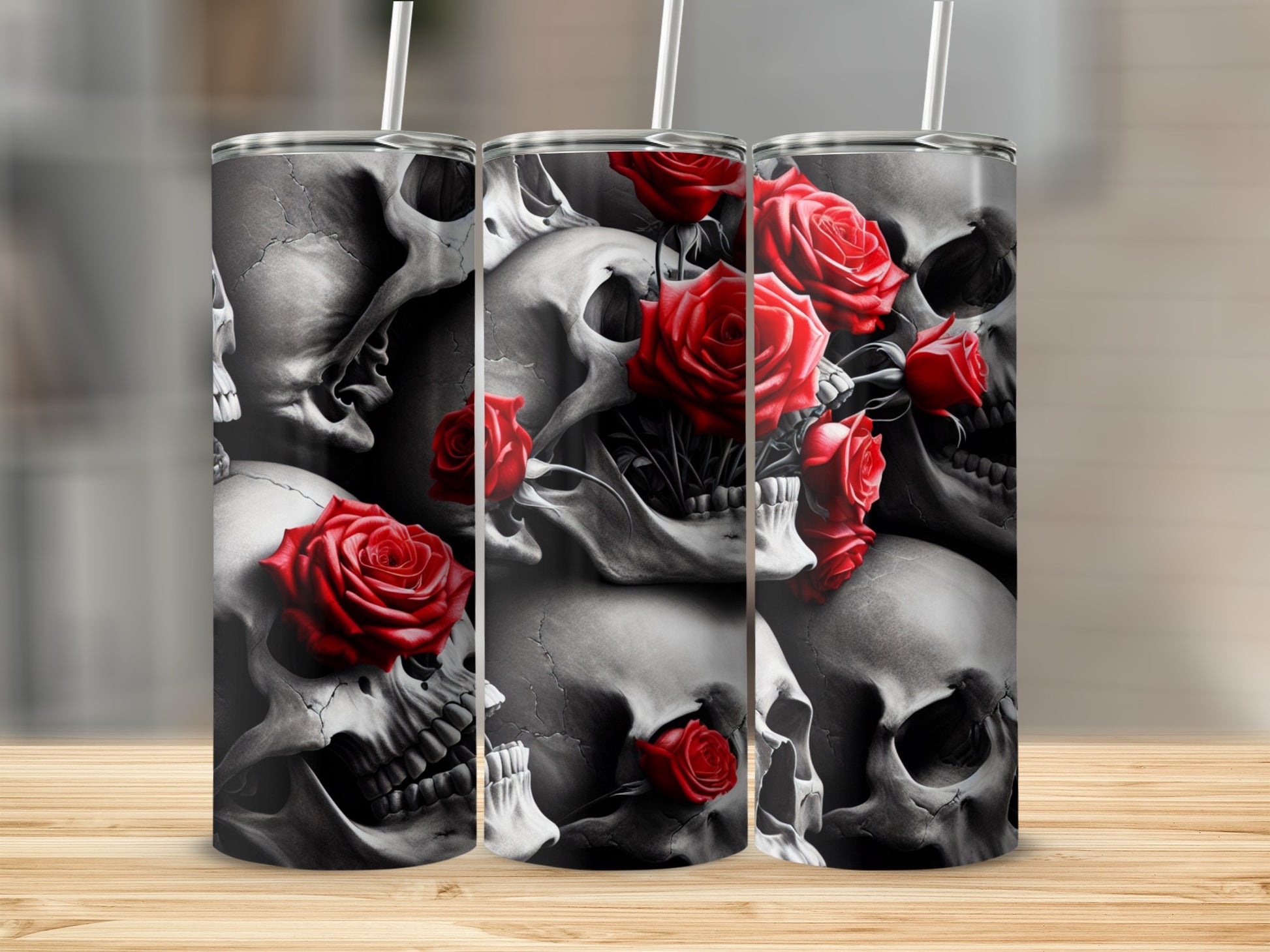 Skulls and red roses design on a cylindrical tumbler with straws.