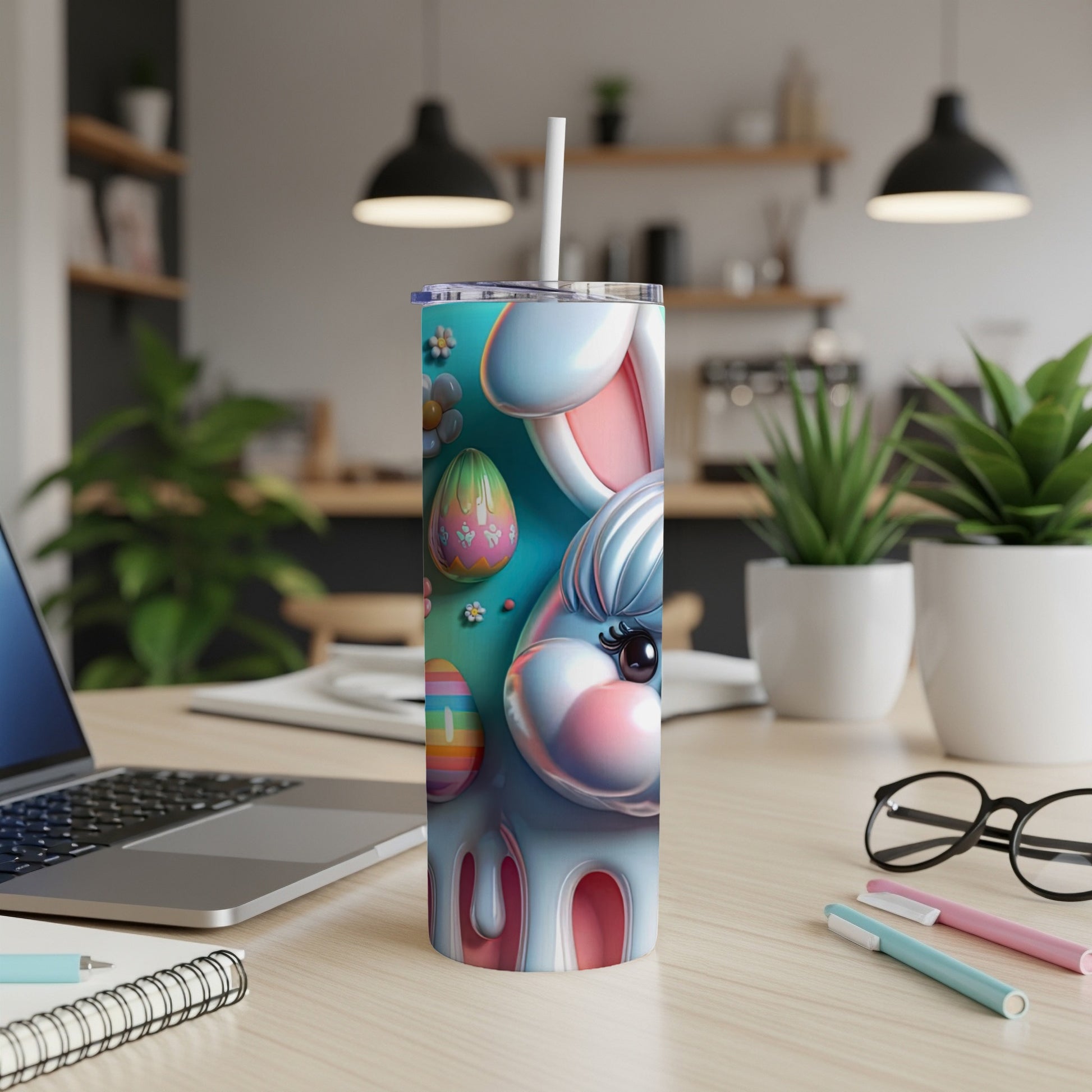 Easter bunny tumbler with colorful eggs and floral accents on a desk.