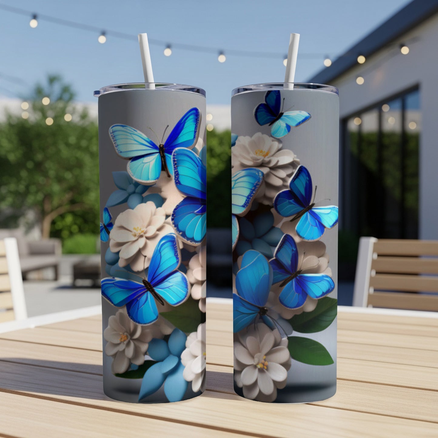 Two tumblers with blue butterflies and white flowers design.