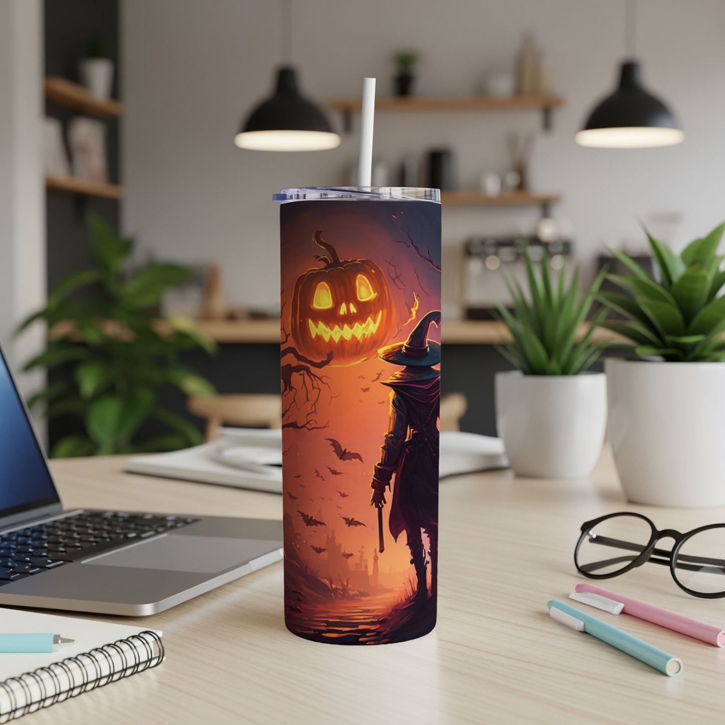 Tumbler with witch and jack-o-lantern Halloween design.