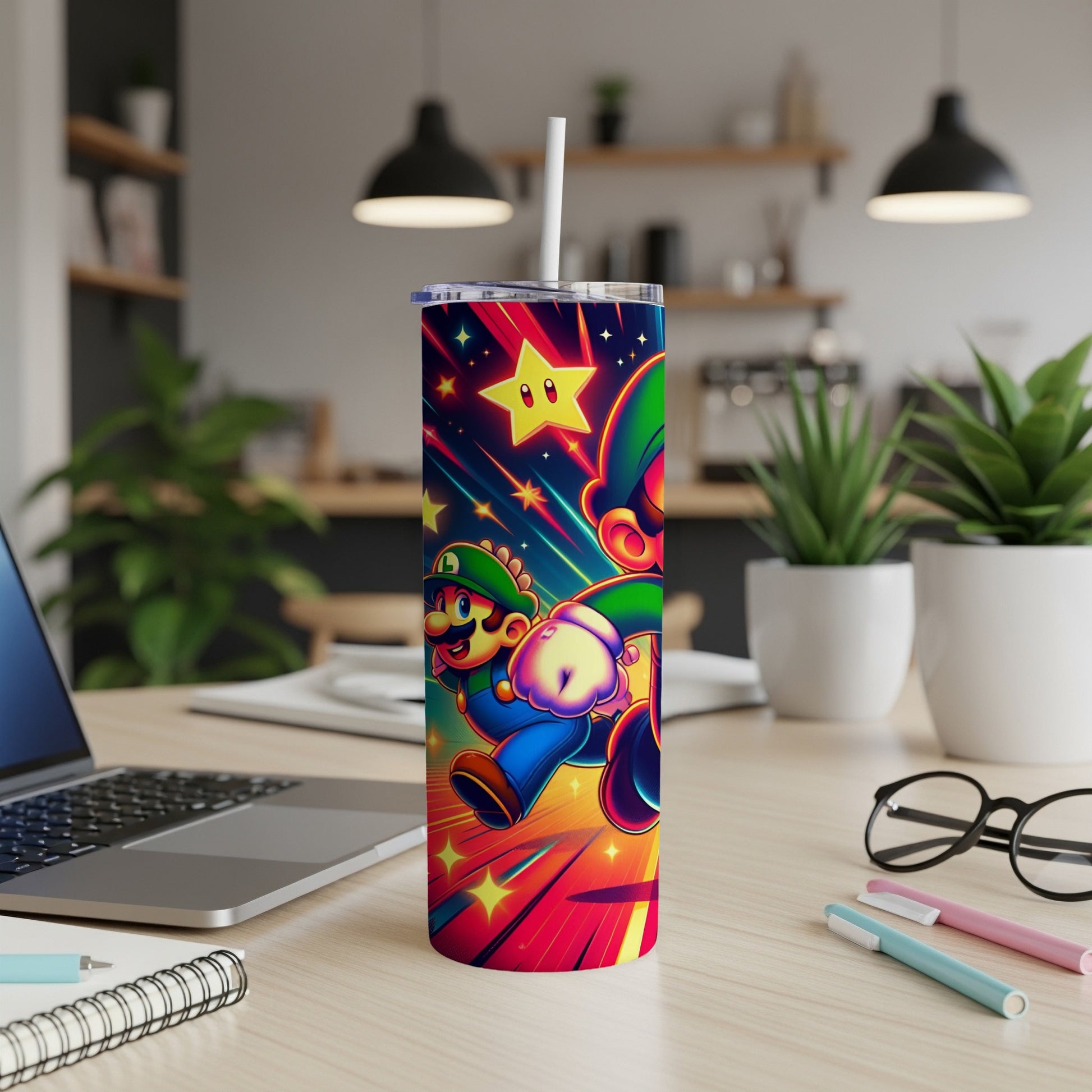 Super Mario characters on a colorful tumbler with a straw, on a desk.