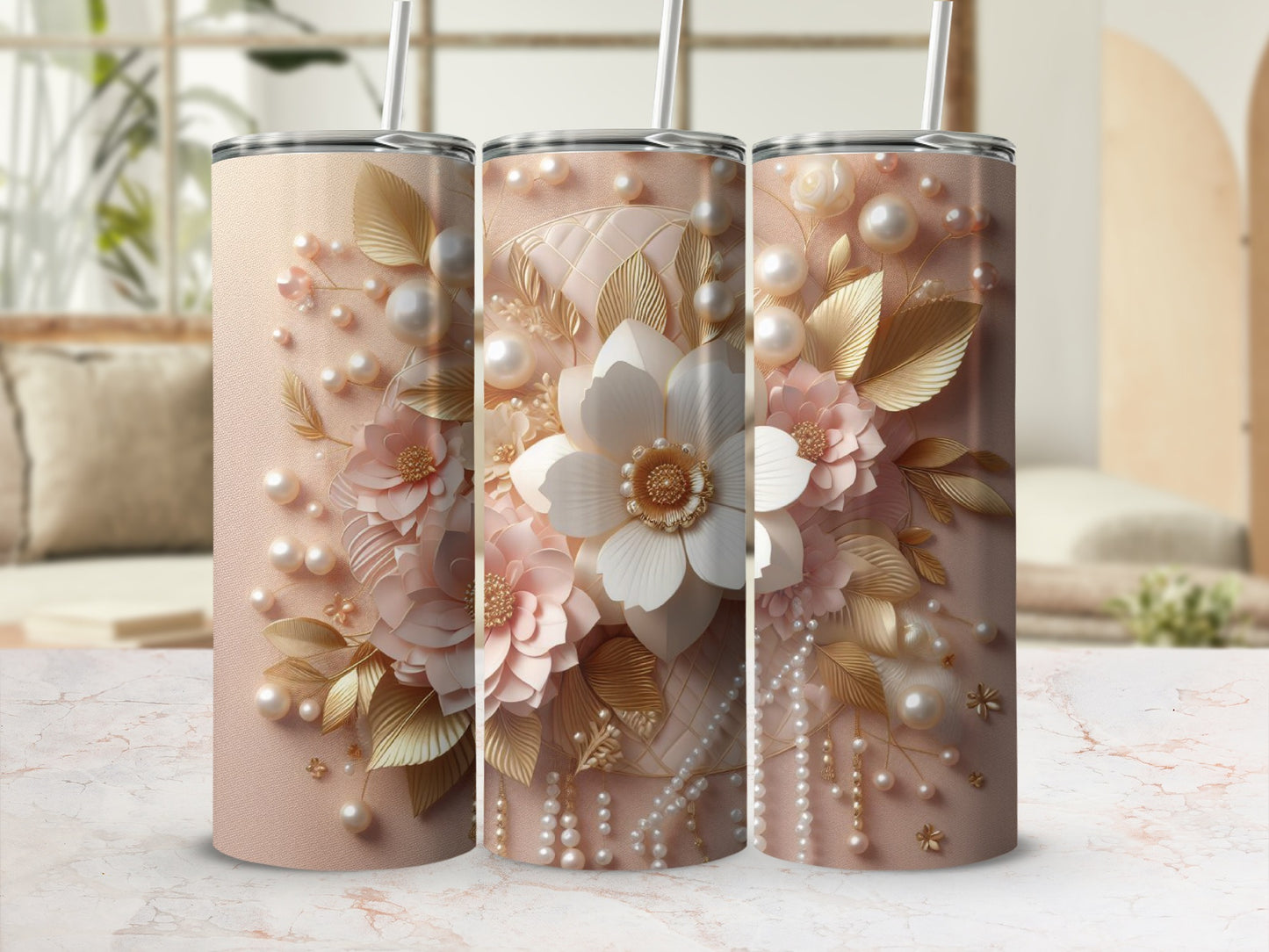 Three light pink tumblers with gold and pearl floral accents.