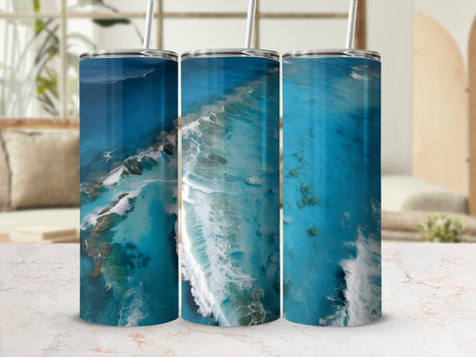 Three tumblers with ocean wave and coral reef designs.