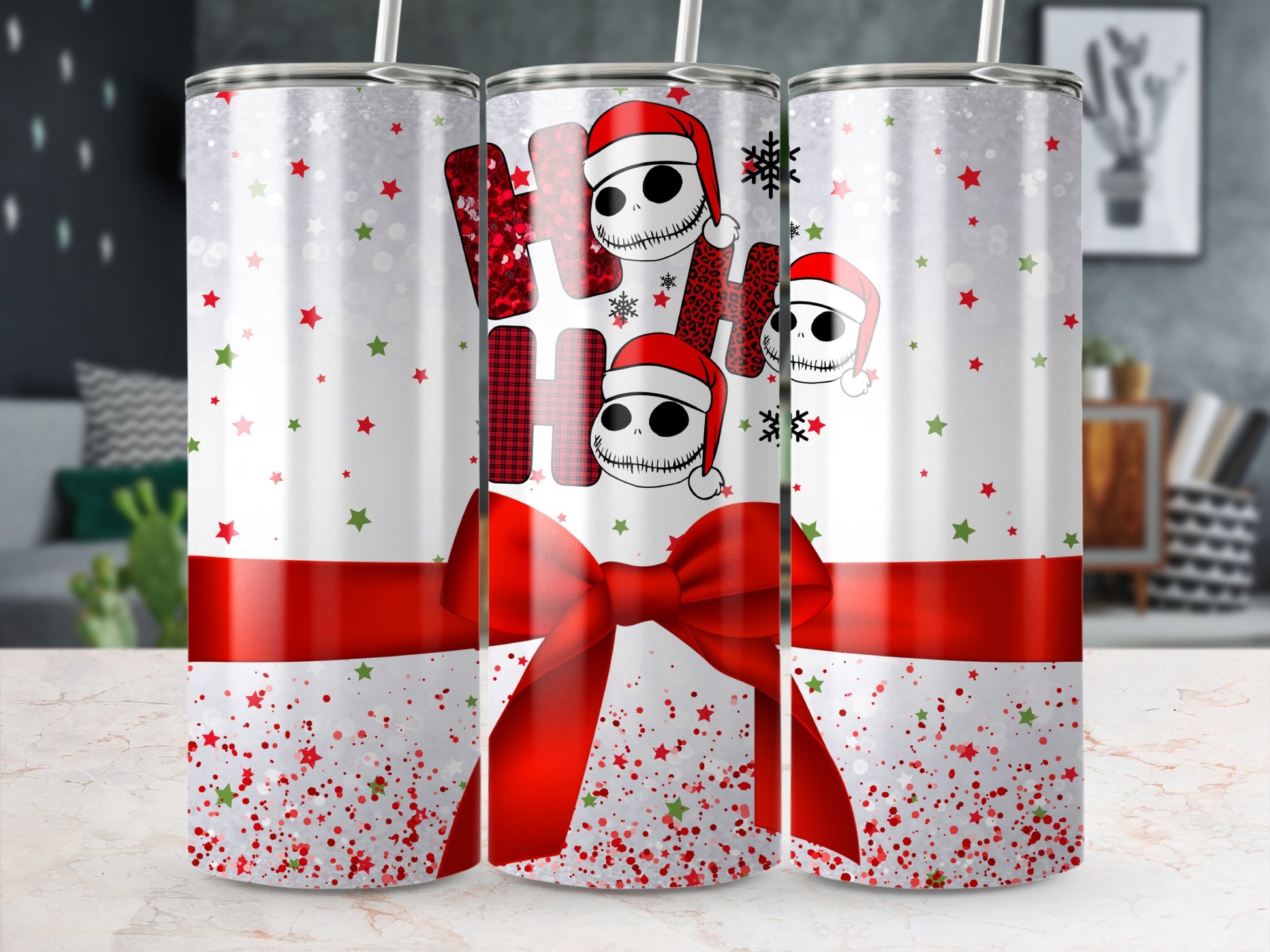 "Ho Ho Ho" text with Jack Skellington heads and red bow on a Christmas tumbler.