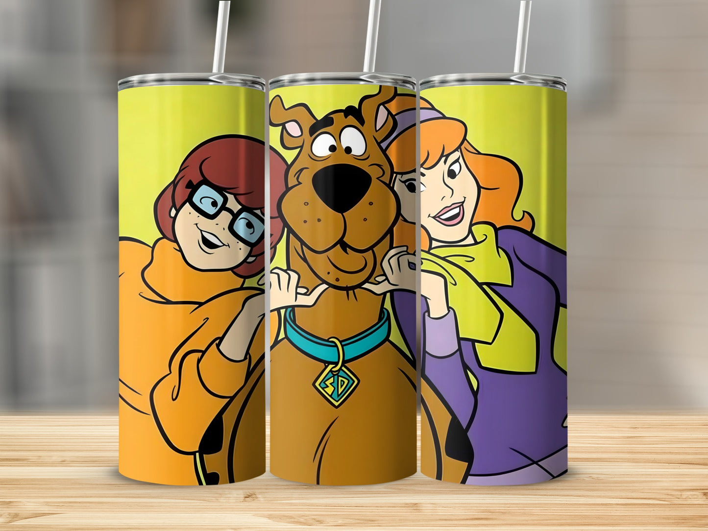 Scooby-Doo characters Velma, Scooby, and Daphne on a tumbler.