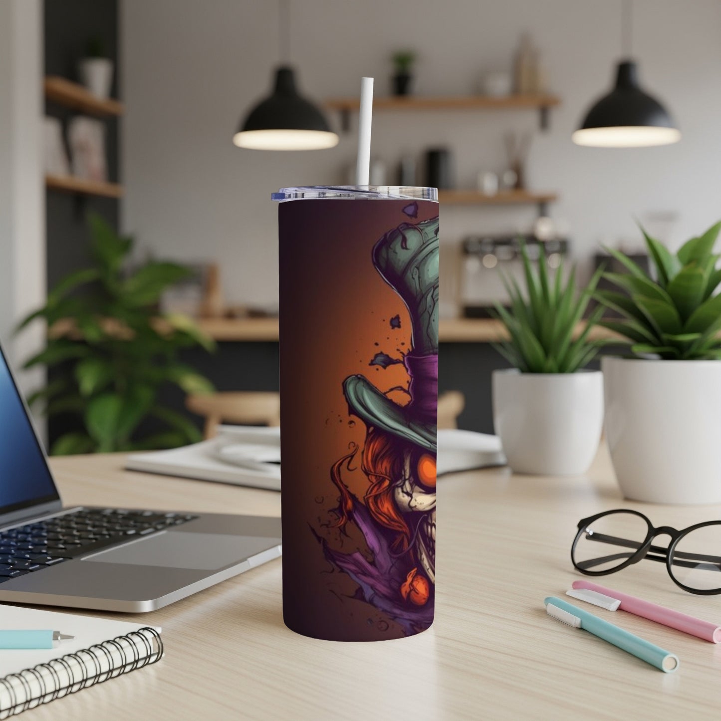 Tumbler with creepy illustration of a skull wearing a top hat and a purple cloak.
