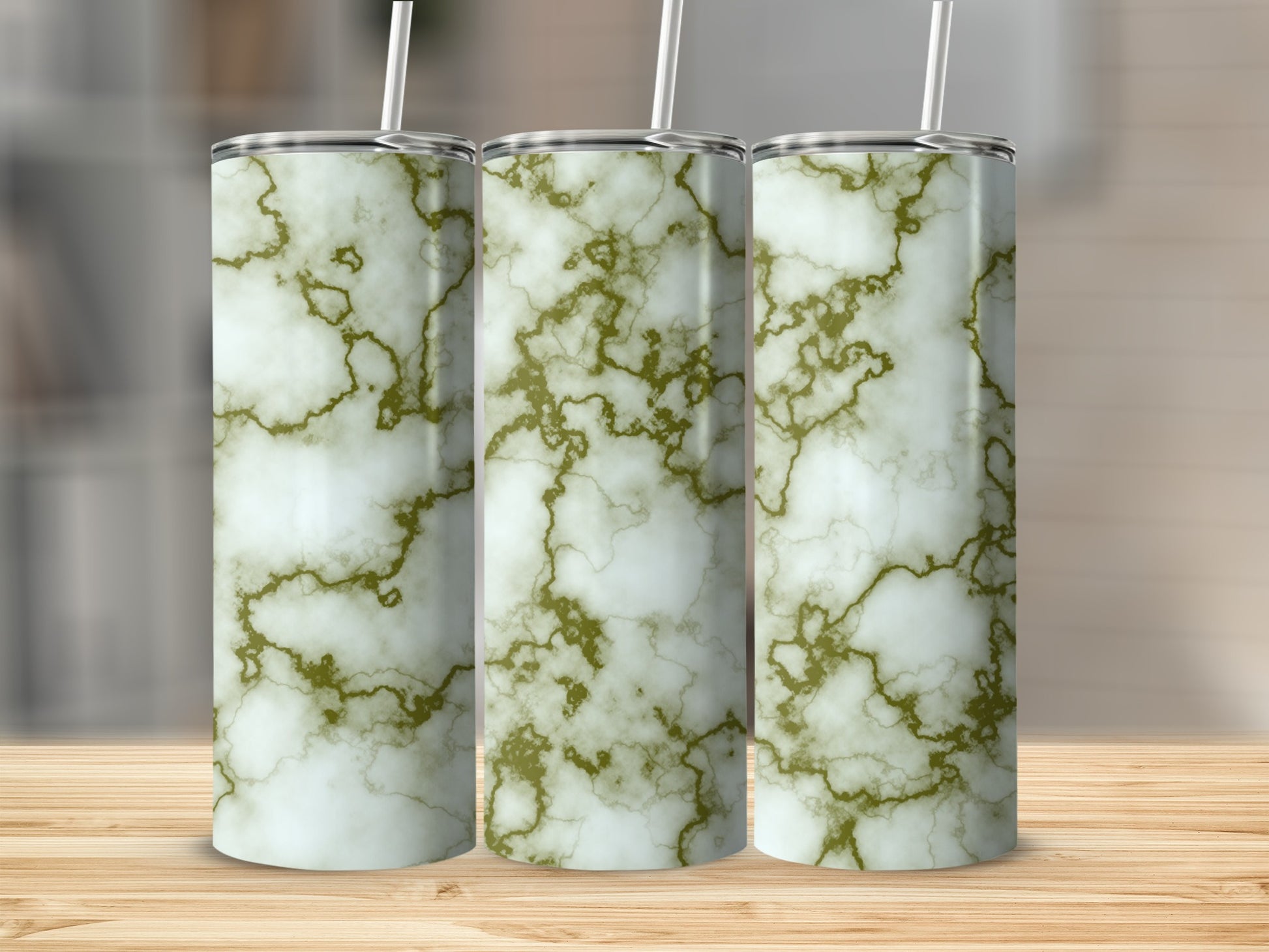 Three tall tumblers with a white and gold marble pattern.