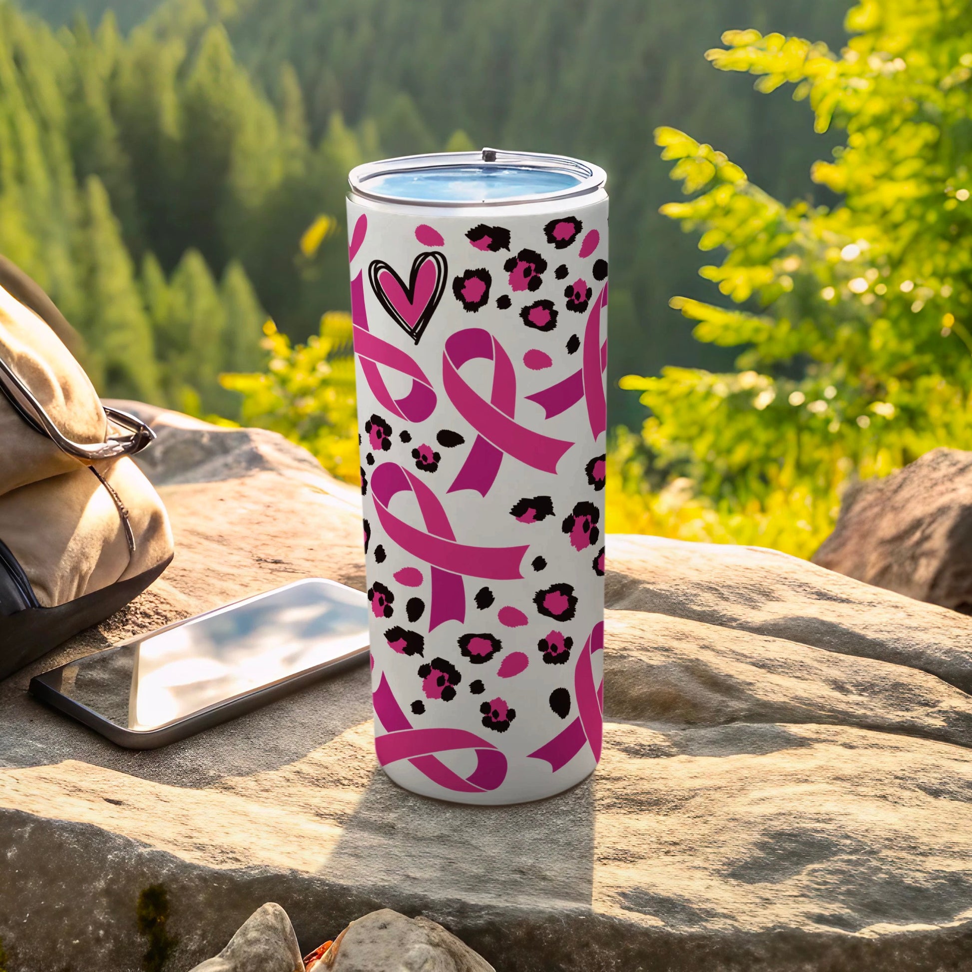 Pink breast cancer awareness ribbons and leopard print on a white tumbler.