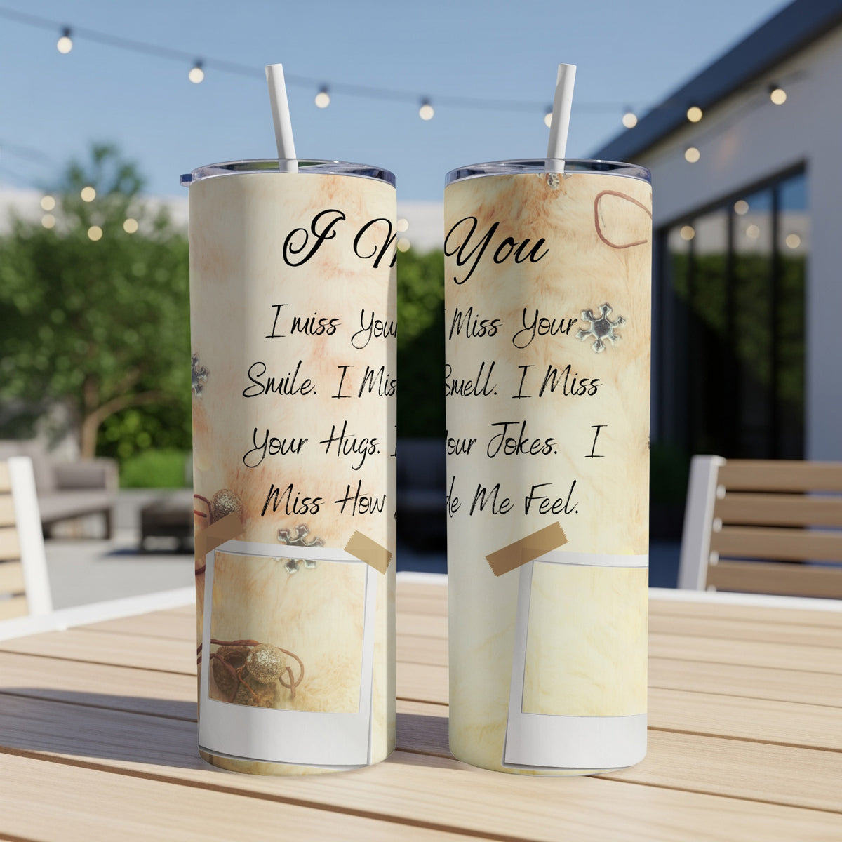 Two tumblers with "I Miss You" text and sentimental phrases on a wooden table.