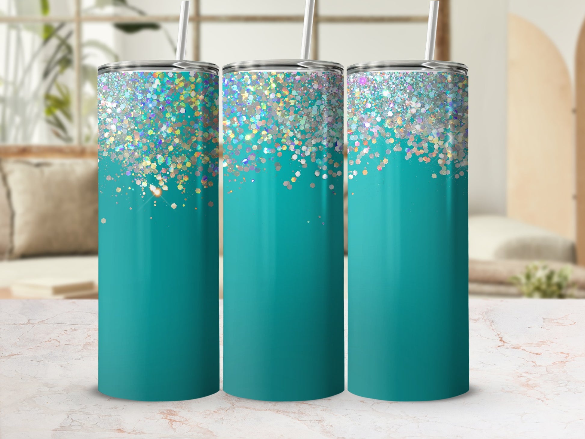 Three teal tumblers with glitter gradient and straws on a marble surface.