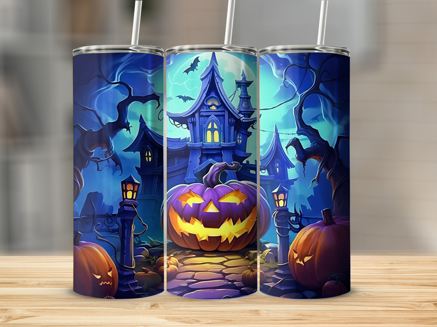 Halloween scene with jack-o'-lanterns and a spooky house on three tumblers.