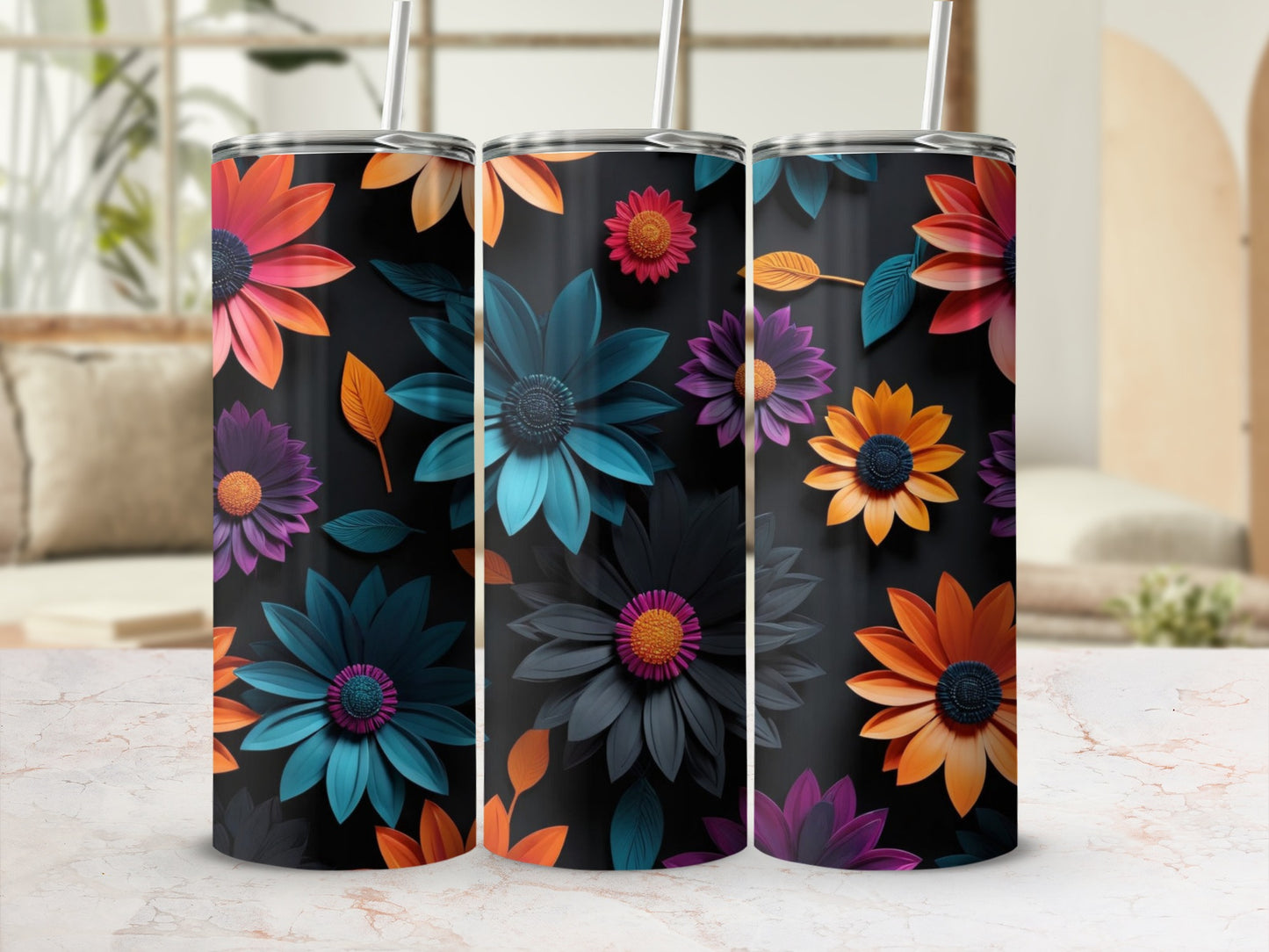 Three tumblers with colorful floral patterns on a dark background.