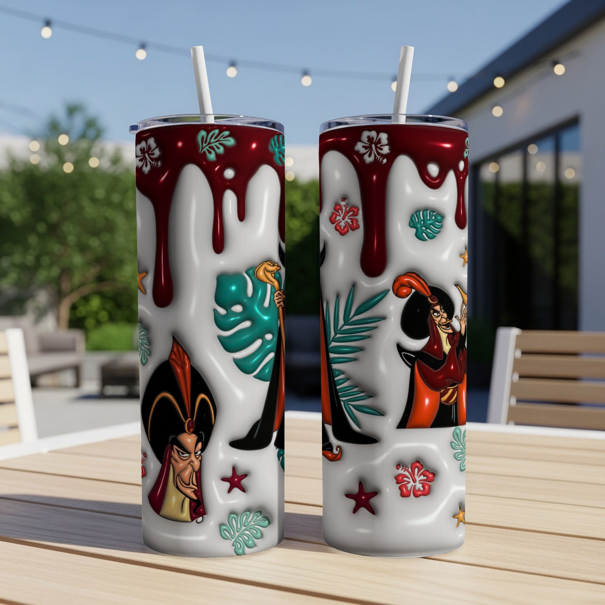 Two tumblers with a dripping red glaze and Jafar character art.