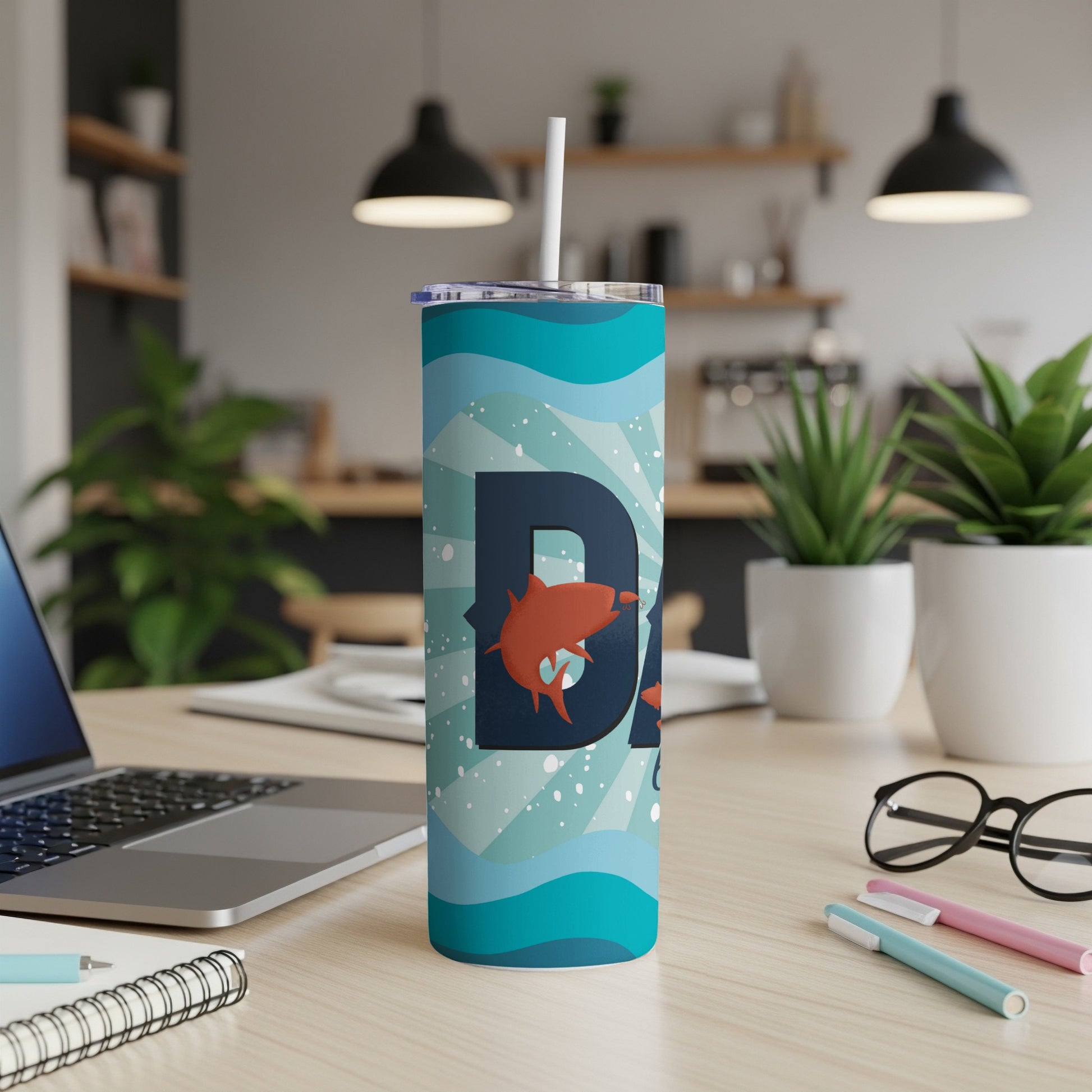 Tumbler with wave pattern, "DAD" text, and leaping orange fish design.