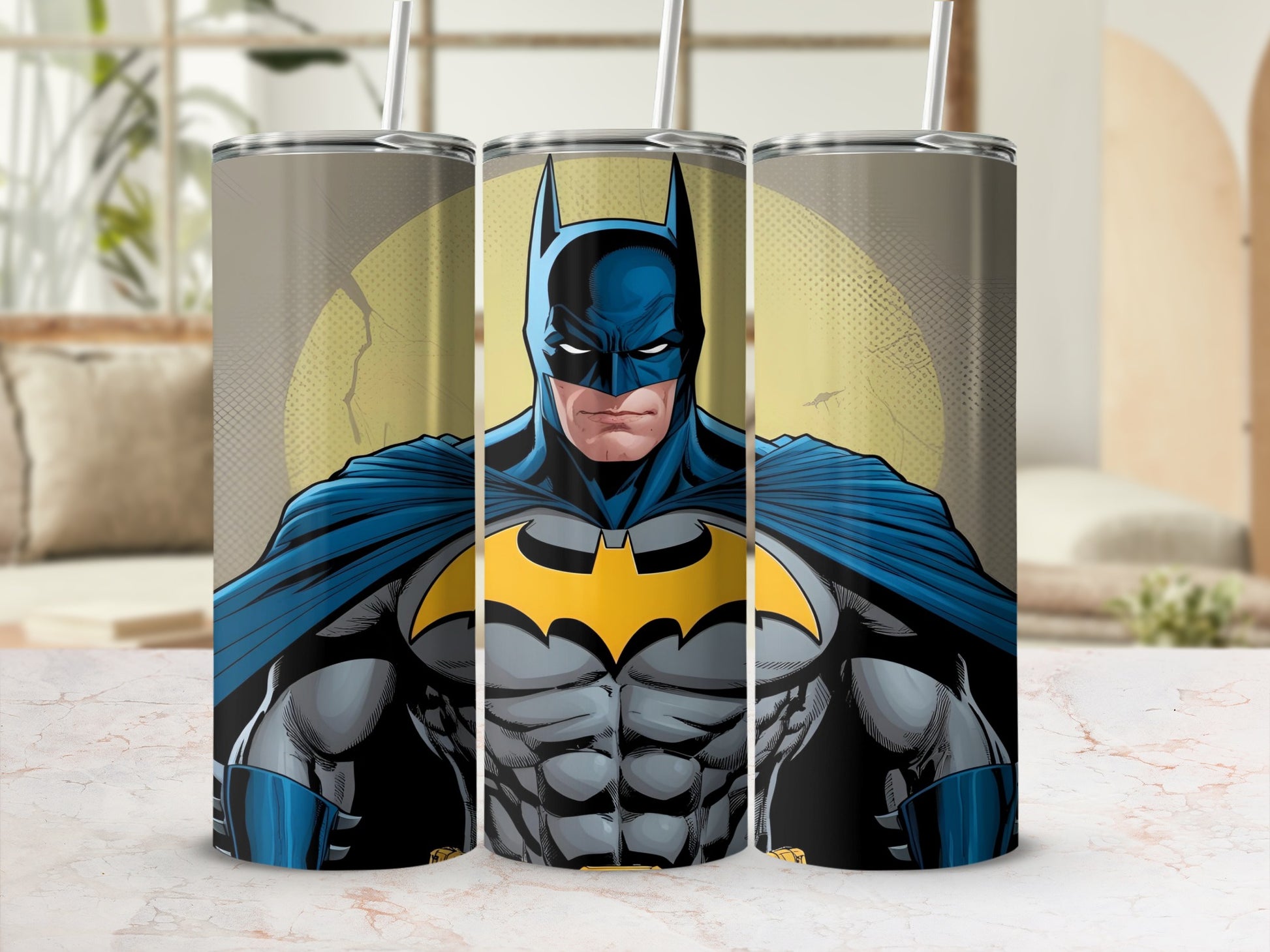 Batman illustration on a skinny tumbler with straws.