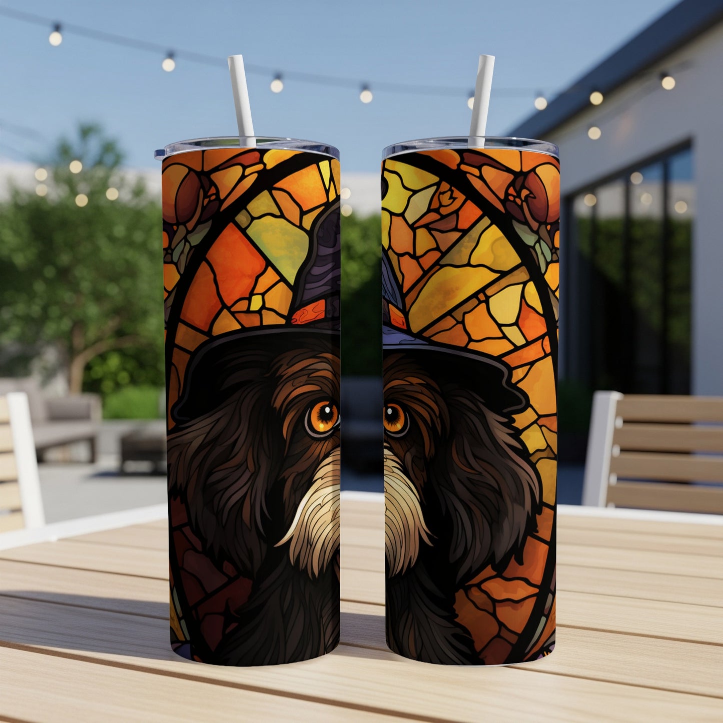 Dog wearing a witch hat in stained glass design on two tumblers.