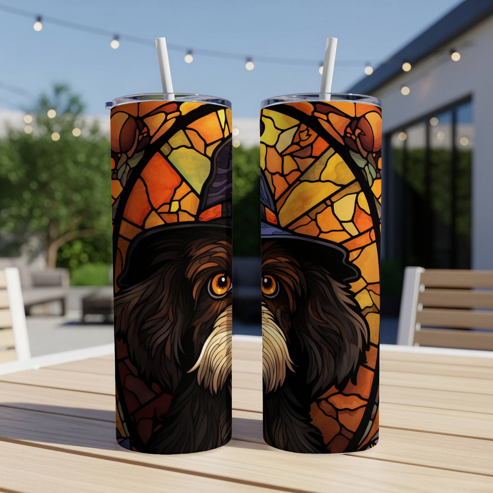 Dog wearing a witch hat in stained glass design on two tumblers.