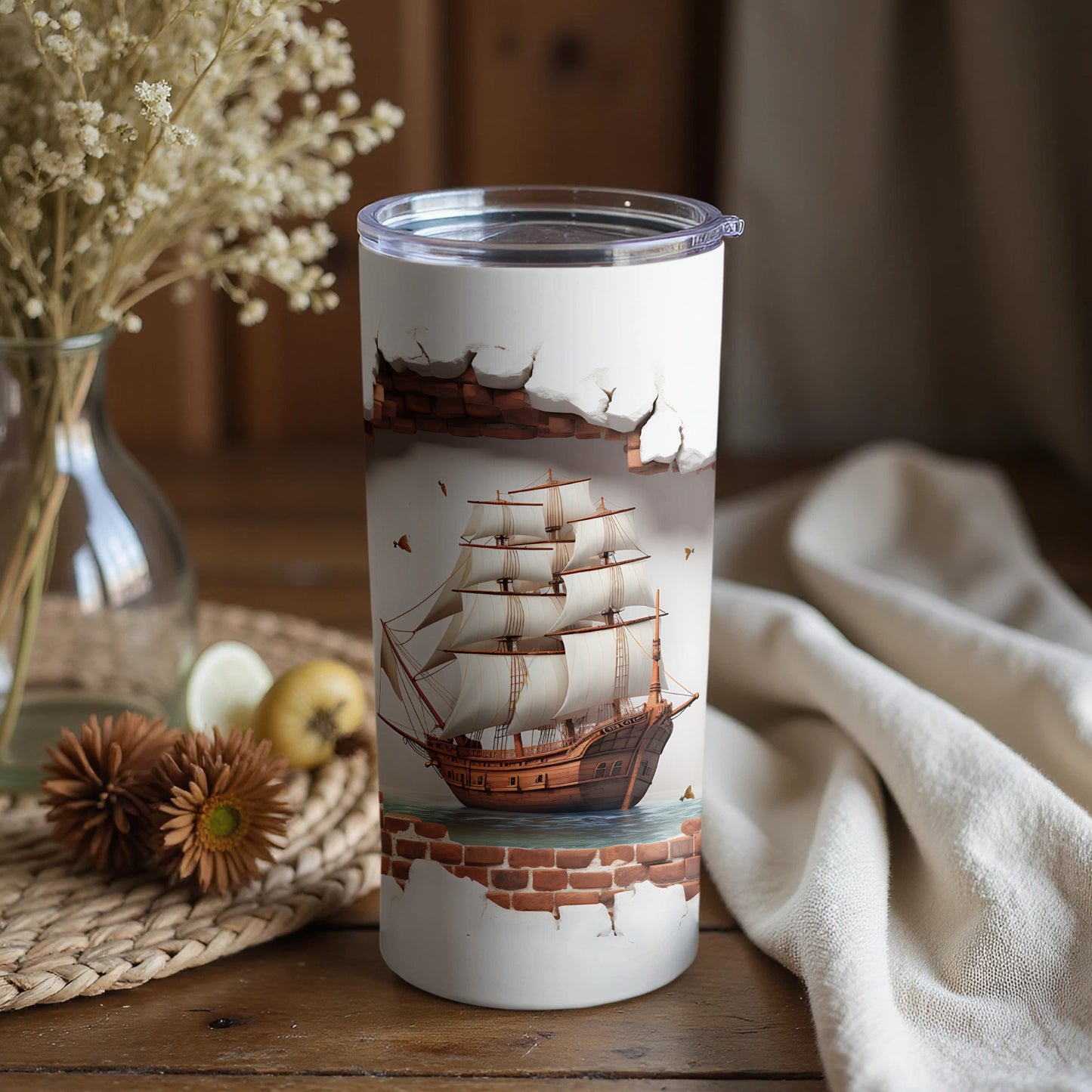 Tall insulated tumbler with ship design sailing away