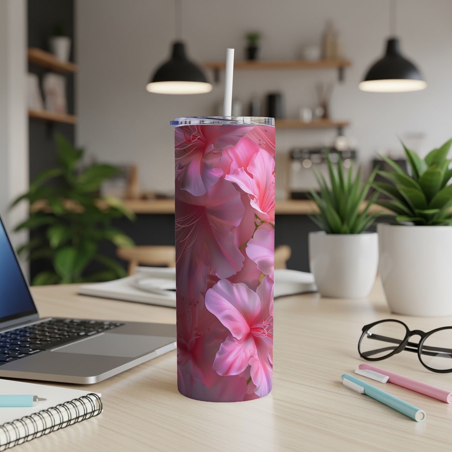 Pink azalea floral pattern on a tall, slim tumbler with a straw.